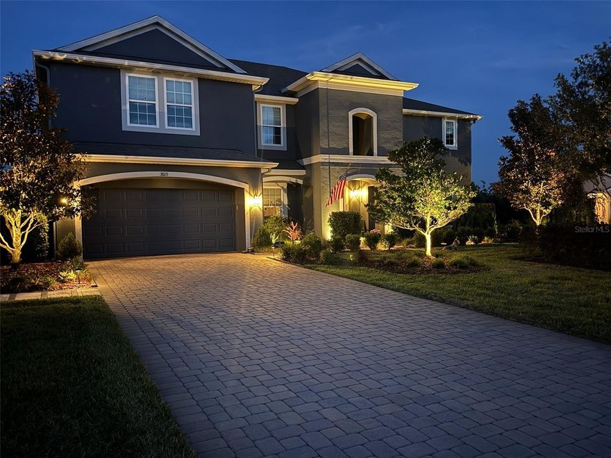 Discover an executive residence that blends luxury, space, and resort-style living in one of East Orlando’s most stunning neighborhoods. This impressive 5,000 sq. ft. home offers 7 bedrooms, 4 bathrooms, and a 3-car tandem garage, all situated on an expansive .59-acre fenced lot with serene water views. Step into a backyard designed for true Florida living. The resort-style oasis features a sparkling swimming pool with sun shelf, a relaxing spa, extensive tropical landscaping, a fully equipped summer kitchen, an inviting outdoor media area, and generous grassy space perfect for play or pets. Inside, the home continues to impress with a chef’s kitchen offering a built-in oven, drop-in glass cooktop, abundant counter space, and a dedicated dining area. Formal living and dining rooms provide elegant entertaining spaces, while the downstairs family room offers comfort and versatility. The ground-floor master suite is a private retreat, large enough for a sitting area and offering direct access to the pool. The spa-inspired master bath includes double vanities, a soaking tub, two linen closets, and an enormous walk-in closet. A second downstairs bedroom, full bath, and laundry room add convenience and flexibility. 
Upstairs, a spacious family room/loft showcases beautiful views of the pond and pool. Five additional bedrooms—each with walk-in closets—are thoughtfully arranged near two full bathrooms. The upstairs main bedroom is generous enough to function as a second master suite. Completing the upper level is a dedicated theater room with a built-in sound system, perfect for movie nights and entertaining. Located in desirable East Orlando, this home offers quick access to the East Coast, 417, UCF, and Research Park, making it ideal for both lifestyle and convenience. With its exceptional layout, luxury features, and resort-style amenities, this property delivers an elevated living experience that stands out in every way.