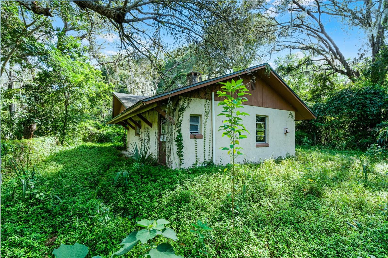 ***ADJACENT LAND TO SOUTH IS ALSO FOR SALE (7625 Clarcona Ocoee Road) under MLS #O6337044.***
A generational family home sits on this expansive 18.35 acre estate. Built in 1950, this custom-built home boasts one bedroom and one bathroom under 616 square feet is surrounded by rolling landscape with mature trees. The front patio takes you into the kitchen which is adjacent to the family room. The primary bedroom features a walk-in closet while the bathroom includes a shower with a door to the side patio. And there is a back patio as well. Older structures on the property include two pole barns.
As you could imagine, there was a time where the family enjoyed not only this home, but the potential in this unique northwest Orlando property lies in the vast mostly cleared pastures and fields. It was a working farm back in the day with horses and cattle and currently zoned A-1 Agricultural where swimming in the pond was a regular activity on hot summer days.
While the home is in need of a lot of work or it may be a teardown and you built your dream home, the potential in this property lies with the land. Build your custom-built dream home or re-establish the homestead as a farm, nursery or equestrian center. Farm animals are permitted subject to county guidelines. Custom built homes, accessory dwelling units and setbacks subject to building codes. The potential is huge for rezoning as well as for city or county government development opportunities like a community complex. Ideal for mixed-used, retail, institutional and nonprofit projects and the possibility for residential development and various real estate ventures.
Easy access to major highways, infrastructure and local amenities. Everything needed to live, shop and play is minutes away. You’ve got country-living in a great location with privacy and access to big city amenities to enjoy all central Florida has to offer. Less than 20 minutes away from schools, hospitals, the YMCA as well as parks, golf and other outdoor activities. DOWNTOWN ORLANDO and its amenities including professional sports, festivals and concerts among other events are also a short drive. And Orlando International Airport and Universal Studios, SeaWorld and Disney World are a 30-minute drive. It’s just 60 minutes to the East Coast and if you fancy a day trip in just two hours you can be on the beautiful beaches of the Gulf of America!!
Prime location and great investment to buy and hold or build and develop with solid growth potential.
You don’t want to miss this rare opportunity to make this substantial plot of central Florida real estate your own!!