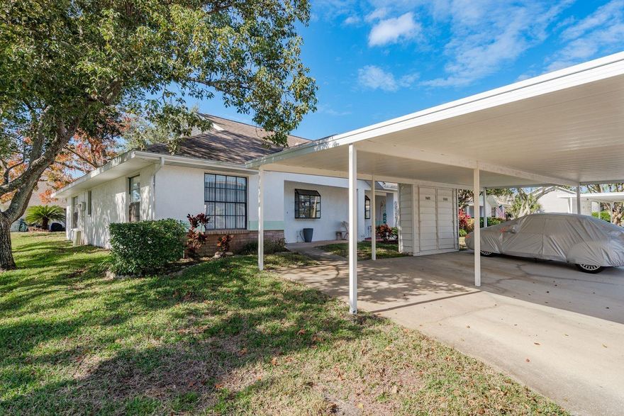 Welcome to this charming TURN KEY!!! 2-bedroom 2 bathroom single level villa situated on a CORNER LOT, perfect for comfort and low-maintenance living. There's LUXURY VINYL FLOORING, no carpet and freshly painted throughout. You'll have peace of mind with the Newer A/C (2025), newer Dishwasher (2026) and Hot water Heater (2023). This well-maintained unit features two large bedrooms with WALK-IN CLOSETS. The primary bedroom has an ensuite bathroom with STEP-IN SHOWER and double sink vanity. The living-dining room has lots of room for entertaining or just relaxing. Step out onto the spacious 3 season lanai, perfect for enjoying morning coffee, al fresco dining or game night. The laundry is conveniently there as well. There is a carport and outside storage too! Close to the beautiful Downtown New Port Richey and the city of Tampa. Fantastic shops and restaurants and Gorgeous Gulf Beaches.  Don't miss this chance to own a well-cared for villa.