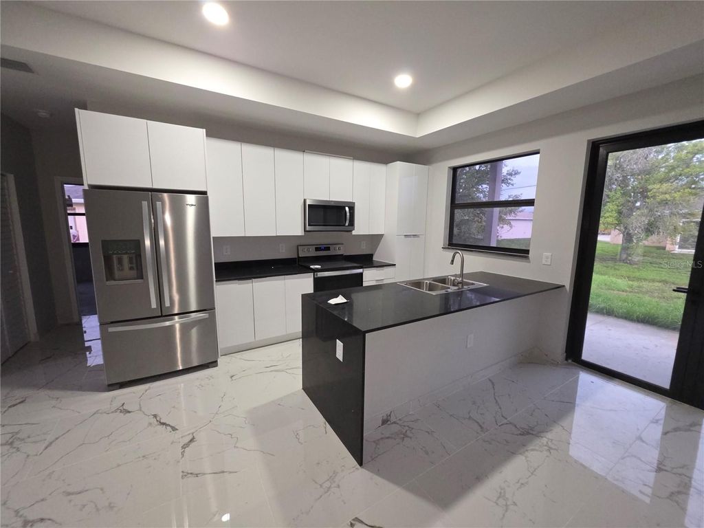 Photo of 1035 Kismet Parkway W, Cape Coral, FL 33993 (MLS # S5140242)