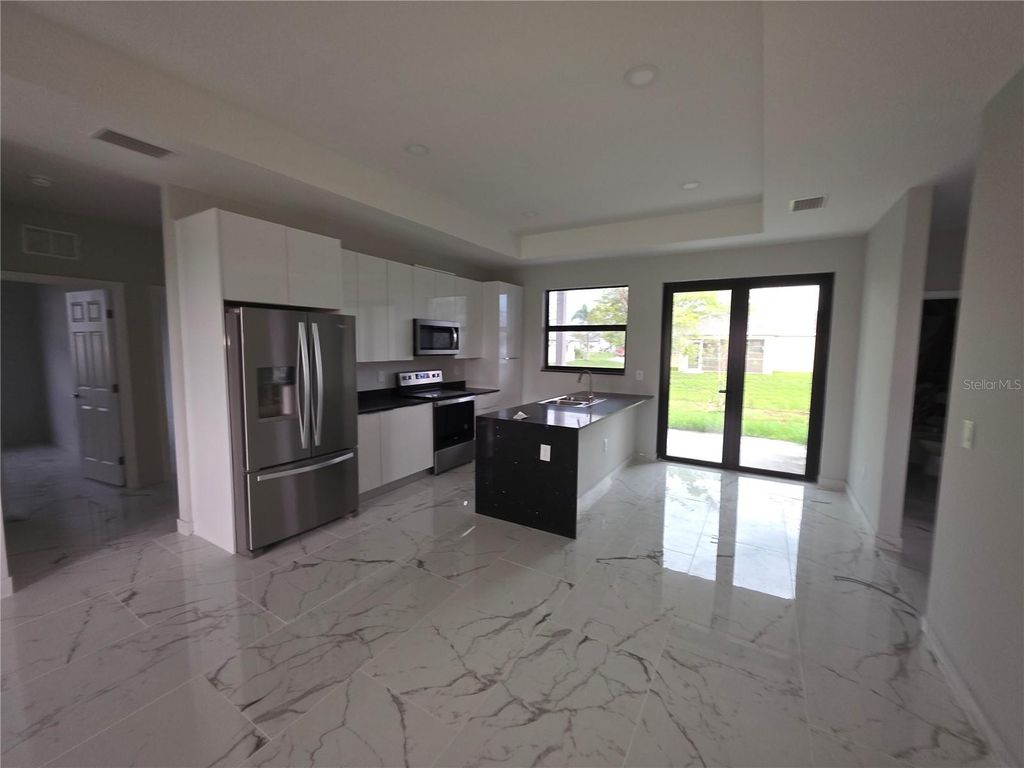 Photo of 1035 Kismet Parkway W, Cape Coral, FL 33993 (MLS # S5140242)