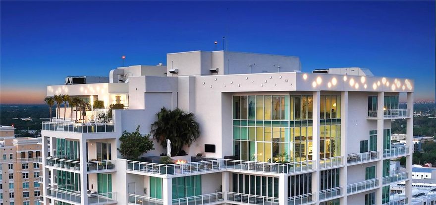Welcome to the pinnacle of luxury living in Downtown Sarasota at BLVD, where entertainment takes center stage. This exceptional condo, situated on the 18th and 19th floors, offers unrivaled access to a rooftop resort-style pool and features a three-car garage with expansive storage—a haven tailored for those who appreciate the finer things in life. Marvel at the mesmerizing city views that stretch from east to west, complemented by the proximity to the dynamic Rosemary district and the scenic Sarasota Bay Park. Ascend to your penthouse sanctuary via a private elevator, stepping into a contemporary haven meticulously crafted by the renowned JKL Design Group. The expansive living area, adorned with soaring 28-foot ceilings and floor-to-ceiling windows, bathes in natural light, providing splendid views from every angle. The gourmet chef's kitchen is a culinary masterpiece, boasting high-end appliances and a custom pergola-shaded 18-foot island that comfortably accommodates 14. The lower level offers a junior suite, two en-suite guest rooms, and a terrace that wraps around three sides of the building. The upstairs media room features built-in surround sound, while the grand primary suite on the 19th floor boasts stunning city lights and water views. The primary bath is a spa-like retreat, and two walk-in closets provide ample space. Designed for entertainment, the penthouse seamlessly connects to the expansive terrace featuring a hot tub, Lynx grill, ice maker, and fridge, perfect for sun-soaked relaxation. For larger gatherings, enjoy easy access to rooftop amenities, including a pool, spa, summer kitchen, fire pit, and ample seating for your guests. Unit #1804 underwent extensive customization and upgrades, ensuring a breathtaking finished product with all the features needed for a luxury lifestyle. BLVD offers top-tier amenities, including a full-time concierge, on-site management, a self-grooming station, a dog park, a golf simulator, a wine cellar and tasting room, and a state-of-the-art fitness center. Embrace modern, coastal, urban luxury at BLVD. Your opulent lifestyle awaits—the time is now, and the place is BLVD.