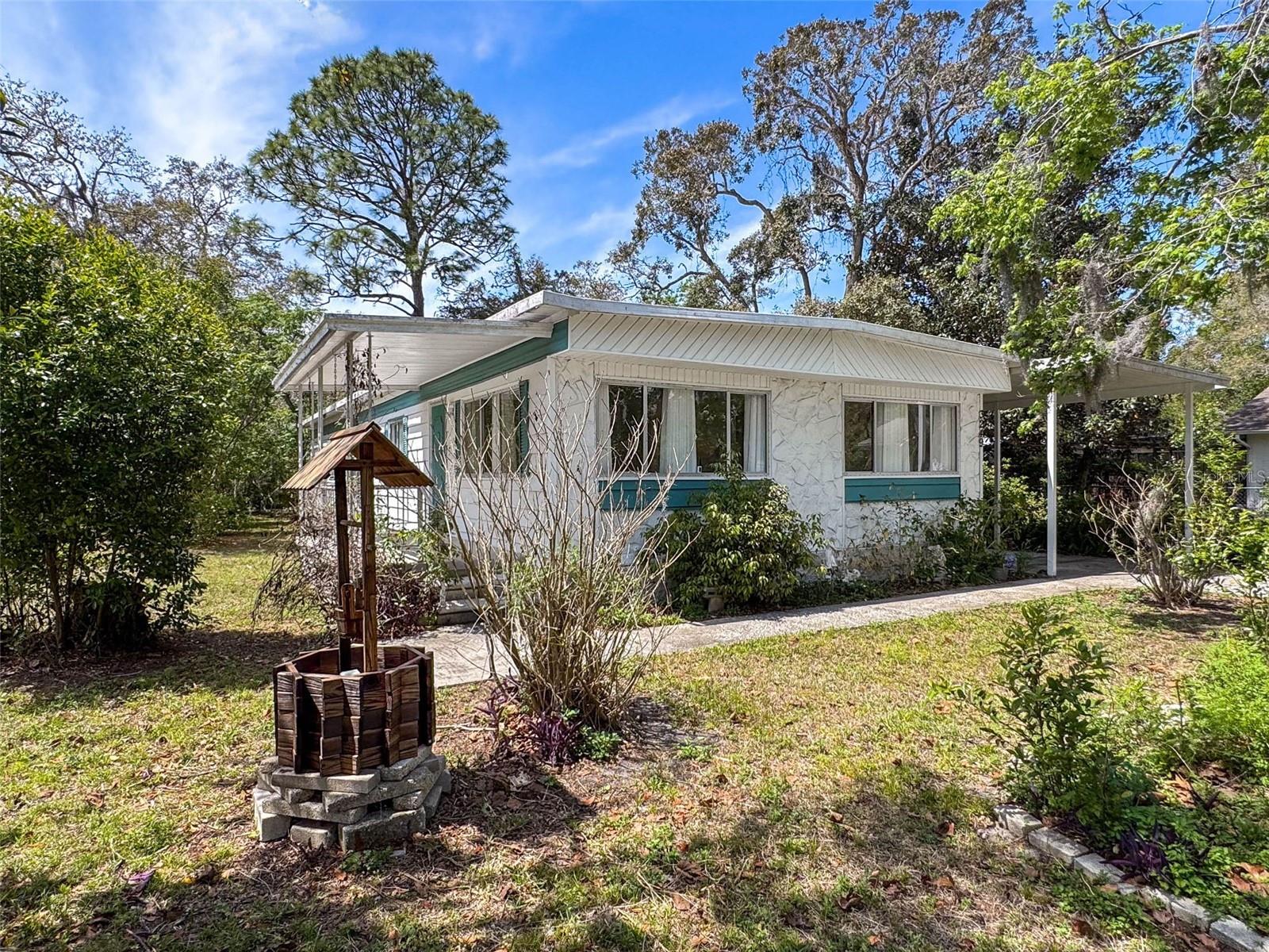 PRICE REDUCED. BRING YOUR BEST CONTRACT PRICE.
Discover this 3 bed - 2 bathroom ready to move into home on a nice .44 acres high and dry lot with 1 shed for all your gardening needs. This is a spacious open plan including the kitchen, living room, dining area, breakfast bar/counter and sitting nook with sliders leading to a screen patio. Step inside and be greeted by the formal living room and dining room with a bank of windows providing great natural light and a view of the front garden. The spacious fully equipped kitchen with all appliances included, has plenty of cabinet storage and countertop space for cooking, eating and entertaining. Meander further as the kitchen seamlessly flows to the sitting nook and screened patio overlooking the side gardens. The Primary bedroom has a private bathroom with a walk-in shower, a walk-in closet and an additional reach in closet. The guest bathroom has a shower/tub combo. Additionally, this home boasts new laminate flooring throughout for durability and ease of cleaning. Step outside to your private garden oasis with various flower gardens, sitting areas and fruit trees, making it the perfect retreat. The large lot offers ample space for parking and storage, making it perfect for new buyers, 2nd home retreats, or anyone looking for extra room to spread out. Newer heat pump/central air with warranty until Oct 2026 (2016), septic system (2022), roof replaced with a roof over - which protects the actual roof and adds a slight pitch, so it is not flat (1992), 6 Ring security cameras and the washer and dryer included, appliance manuals provided, continuous pest control, and a home warranty provided. So nice to not have to worry about the major cost items. Zoned R1A, this property provides both privacy and flexibility while still being close to all the amenities, shopping, banks, schools, restaurants, and a short drive to the Gulf, Pine Island Beach and the Weeki Wachee River, which is great for kayaking and other water sports. 45 minutes to Tampa International airport. No HOA’s or CDD and NO LOT FEE, no flood insurance required. Cash or non-traditional financing. Make your appointment today to view this great property.