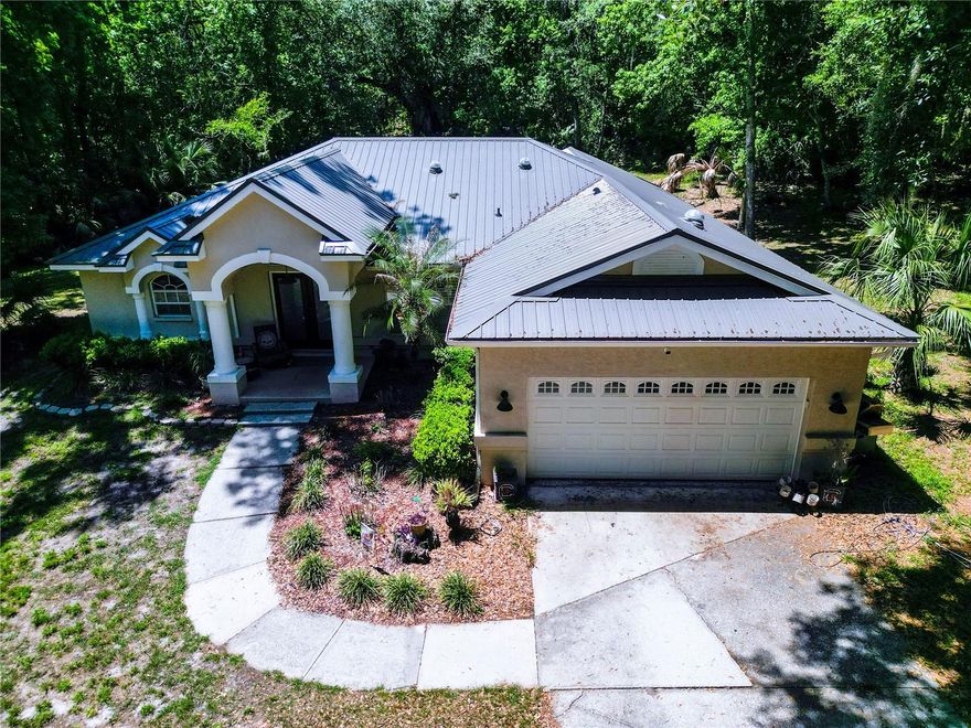 Experience the perfect balance of privacy, space, and modern updates with this exceptional 4-bedroom, 2-bath pool home situated on 5 acres in Brooksville. Surrounded by mature oak trees and natural Florida landscape, this property offers a peaceful setting while still providing convenient access to nearby amenities. Inside, the home features ceramic tile in the main living areas and the primary suite, an updated primary bathroom, and a well-appointed kitchen with granite countertops and newer stainless steel appliances. Major improvements include a metal roof installed just one year ago, a newly paved driveway, and a newer HVAC system (2023), offering both value and peace of mind.Step outside to enjoy your private pool and expansive acreage, ideal for entertaining, outdoor activities, or simply enjoying the natural surroundings. The property also includes a 2-car attached garage and an additional detached 2-car garage/workshop, providing ample storage and workspace options. Zoned AR, this property allows for flexibility in use and lifestyle.A recent appraisal completed this month reflects the home’s value, and it is currently listed under appraised value, presenting a compelling opportunity for buyers. The sellers are motivated and prepared to move quickly. Seller is offering up to $7,000 toward the buyer’s closing costs with an acceptable offer. Schedule your private showing today to fully appreciate everything this property has to offer.