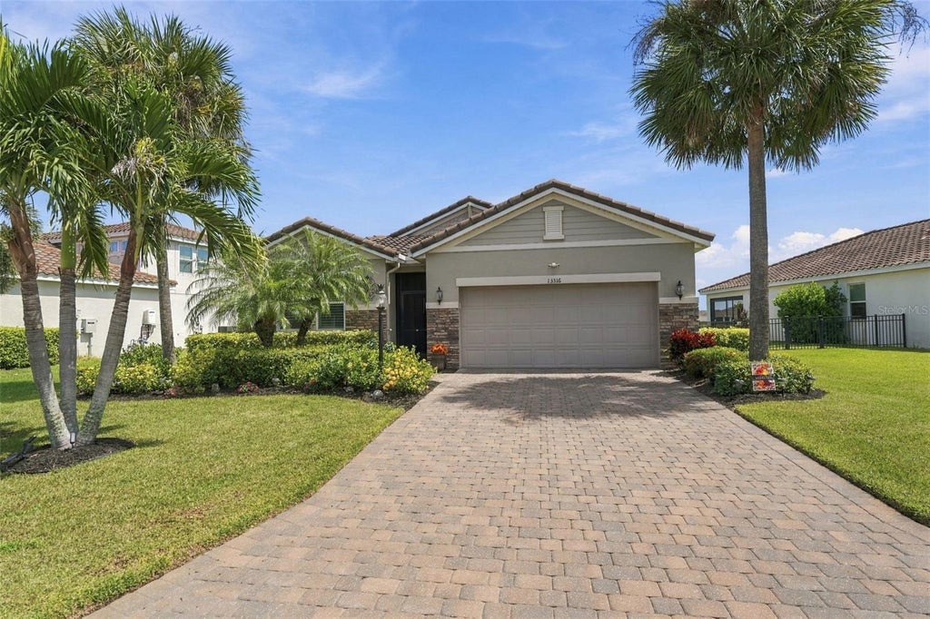 Photo of 13316 Saw Palm Creek Trail, Bradenton, FL 34211 (MLS # A4708617)