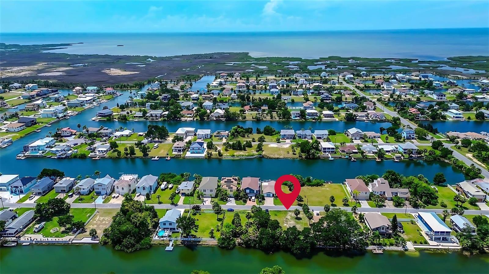 More pictures coming soon!! Build your coastal dream on this rare 0.11-acre canal-front lot (approx. 50x100 ft) in a peaceful waterfront setting. Enjoy indirect Gulf access via a saltwater canal and boat lift, perfect for boating, kayaking, or paddleboarding. Zoned PDP, this level, buildable lot offers design flexibility and is located in Flood Zone AE, ideal for elevated construction to take in water views and breezes. With no HOA, nearby utilities, and paved road access, this is the perfect spot for a weekend getaway or year-round retreat!