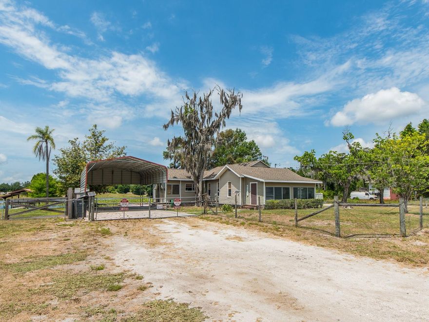 Motivated seller. Rare opportunity to own lakefront property in a quiet, tucked-away area of the Keystone / Odessa area with no HOA or deed restrictions. Situated on a 0.38 -acre lot, this 2-bedroom, 1-bath home offers the perfect combination of waterfront views, privacy, and flexibility. Inside, the home features a light-filled Florida room, a comfortable living area with a wood-burning fireplace, a spacious dining area, and an eat-in kitchen with a functional layout. The bedrooms provide flexibility for a variety of uses, while the overall layout provides a comfortable and practical living space. The interior retains its original character, key system updates provide added peace of mind, including a new roof (2021), new A/C compressor (2025), new well pump (2024), reverse osmosis system, and a recently purchased water refinement system ($13,000). Outdoors is where this property truly stands out, highlighted by a free-form, glass-tiled pool overlooking the lake, complete with a heater for year-round enjoyment. The property also features a large covered carport with ample space for RV or boat parking, offering versatility for a variety of lifestyles. Enjoy true Florida lakefront living, fish, kayak, or simply unwind from your own backyard, while still being conveniently located near shopping, dining, medical facilities, Tampa International Airport, parks, and Gulf beaches. Whether you're looking to renovate, invest, or create your own private waterfront retreat, this is a unique opportunity in Keystone / Odessa Market.
