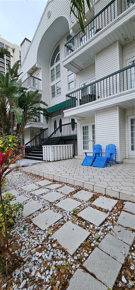 This luxurious three-story waterfront condo in South Tampa is nestled in a serene location along the renowned Bayshore Boulevard. The open floor plan creates a bright and spacious space complemented by a wood-burning fireplace. The kitchen features stainless-steel appliances, quartz countertops, a tile backsplash, a large center island, white cabinetry, pendant lighting, and a convenient wine rack. The primary bedroom located on the third floor offers a large walk-in closet and a private balcony that offers partial water views. Stovall Commons is an intimate 6-unit community overlooking Bayshore with a private pool and surrounded by everything you want in South Tampa!