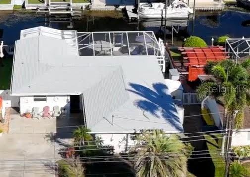 LIVE WHERE OTHERS VACATION!
Beautiful 3-bedroom, 2-bath, 1-car garage home with a caged pool and seawall backing to a freshwater canal leading directly to Lake Tarpon. This move-in-ready home offers the perfect blend of comfort, functionality, and Florida waterfront living.
The updated kitchen features white raised-panel wood cabinetry, granite tile countertops, and stainless-steel appliances, with a breakfast bar opening to the dining and living areas—ideal for entertaining. A wall of French doors floods the living space with natural light and leads to the screened pool area, which includes a large covered lanai for shaded relaxation.
The split-bedroom layout offers privacy, with the primary suite featuring an ensuite bath and large double closet. The second bedroom also includes a double closet, while the hallway provides multiple storage options including two closets and a linen closet. Just off the kitchen is a convenient laundry room with additional cabinetry. A **versatile third room—perfect for an office, den, or bedroom—**has French doors to the pool area and its own side entry door.
Outdoors, enjoy a 64-foot seawall, wood decking up to the water’s edge, and low-maintenance putting turf with a doggie door for your four-legged family members. Roof (2022), AC (2020), and water heater (2024) provide peace of mind.
Why just vacation in paradise when you can live here year-round? Dock your boat right behind your home and cruise to Lake Tarpon for fishing or lunch at Tarpon Turtle!