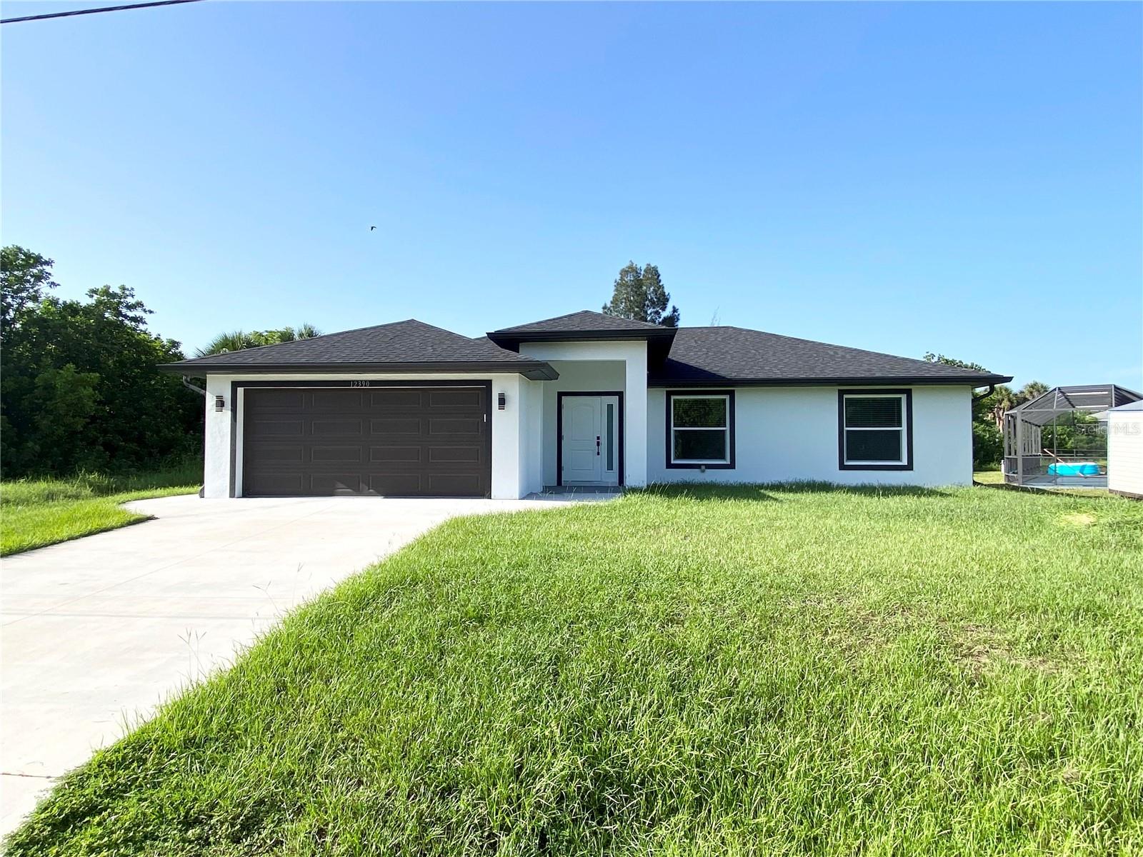 WARM MINERAL SPRINGS AREA!!! Welcome to your dream home in North Port, FL! This stunning boasts a modern and inviting open floor plan, designed for both functionality and luxury living. With 3 spacious bedrooms and 2 elegantly appointed bathrooms, this custom-built residence offers the perfect blend of comfort and style. Step inside and be greeted by the soaring high ceilings that create an airy and expansive atmosphere throughout the home. The heart of this abode is the Quartz counter tops, and top-of-the-line stainless steel appliances, the windows blinds and much more. Exterior includes screened covered lanai, extra sidewalk and patio space on right side and back of the house, gutters. This property is only one mile away from Warm Mineral Springs, just under 5 miles to Wellen Park and 3 miles to Cocoplum shopping area. This house is Conveniently located on a street with new homes around very close to I-75, shopping, dining and many local beaches. Also located in North Port close to several schools and a short car ride away from Centennial Park and Pool as well as a variety of dining and shopping options including Cocoplum Shopping Center. Take advantage of all the area has to include multiple golf courses and TWO Major League Baseball Spring Training stadiums! Within 5 minutes drive you can be at WELLEN PARK, the new Atlanta Braves Training Stadium, Cool Today Park, and the highly anticipated new Costco store!!! Close to shopping, restaurants, and River. Within 25 minutes drive , you can be at Manasota Beach on the Gulf of Mexico, Aquatic Center, and much more. No HOA/ CDD!!! NO FLOOD INSURANCE REQUIRED! Call now to schedule a showing before this home passes you by!!!