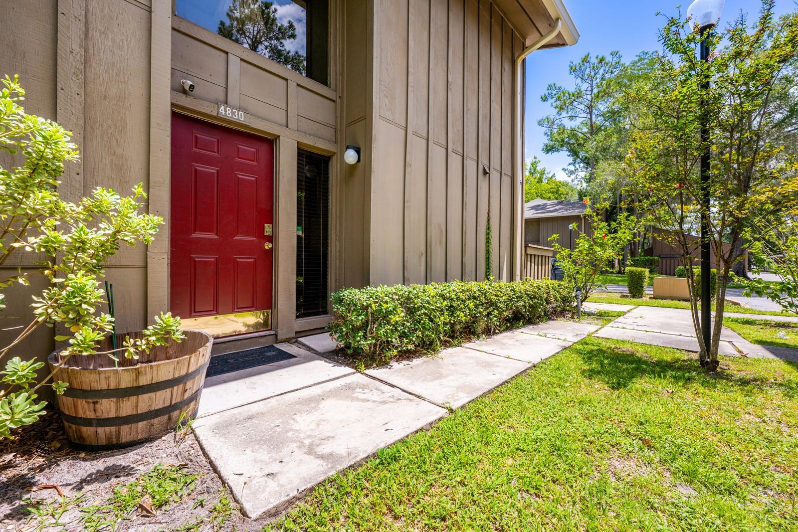 One or more photo(s) has been virtually staged. This property QUALIFIES FOR A CREDIT UP TO $3900 through the seller's preferred lender! ***Welcome to Cypress Woods where townhouse style living, convenience, and a peaceful setting come together in this well maintained 3BD/3BA END-UNIT condo! Tucked into a quiet, tree lined community just minutes from Orlando’s top attractions, this bright and airy home delivers a rare mix of seclusion and accessibility. Stepping inside you will find a spacious living area with a soaring TWO-STORY CEILING, natural light pouring in, and a layout that feels more like a home than a condo. The living area flows seamlessly into the dining room and kitchen, with updated lighting and WOOD & TILE FLOORING THROUGHOUT - no carpet anywhere! The kitchen offers granite countertops, NEWER APPLIANCES, a cozy breakfast nook, and direct access to a FENCED PATIO – perfect for morning coffee or alfresco dining. The MAIN FLOOR BEDROOM includes EN-SUITE BATH access, ideal for guests, roommates or multi-generational living. Upstairs, your PRIMARY SUITE opens to a PRIVATE BALCONY with WATER and CONSERVATION VIEWS, an ideal spot for bird watching or enjoying both the morning and sunset skies. A third outdoor space, the SCREENED LANAI (also featuring wooded and water views!) off the living area adds even more space to relax and unwind. This home has been well maintained over the years: popcorn ceilings removed and painted interiors, updated doors and light fixtures, refreshed landscaping, and NEWER MECHANICALS that include a ***NEW ROOF (2024) – UPDATED A/C (2020) – and a NEW WATER HEATER (2020).*** The community itself is small, friendly, and mostly owner occupied, with mature trees, well-kept grounds, and a sparkling COMMUNITY POOL just steps away. The HOA is responsive and the unit comes with two assigned parking spaces, one of them covered. In a great location with easy access to Conroy Rd, I-4, Florida’s Turnpike, and Turkey Lake Rd, this home offers the ideal “close but not too close” proximity to Universal theme parks, shopping at Millenia, and a wide variety of dining and entertainment options. If you are looking for a home that feels tucked away but puts every convenience at your fingertips, this light filled Cypress Woods end-unit delivers. Updated with a modern edge, and move in ready – but with room to make it your own. Call today to schedule a tour!