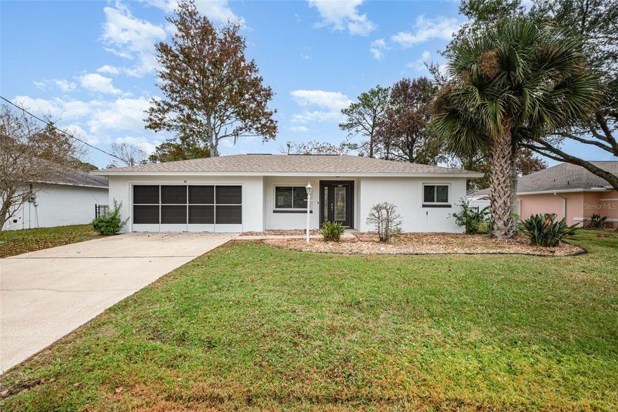 One or more photo(s) has been virtually staged. Welcome to this inviting 3-bedroom, 2-bathroom custom home located in the desirable Palm Harbor neighborhood of Palm Coast. Step inside and admire the designer tile floors, vaulted ceilings, and freshly painted interior that create a bright and welcoming atmosphere.
The kitchen features rich cherry cabinets, granite countertops, a stylish glass tile backsplash, and stainless steel appliances—perfect for cooking and entertaining. The split floor plan provides excellent privacy, with tile flooring throughout the bedrooms. The primary suite offers a designer-tiled shower and a spacious walk-in closet.
You’ll love the convenience of the indoor laundry room, which is exceptionally large and offers plenty of storage space. The oversized garage includes painted flooring, a garage door opener, and screened doors. The fully fenced backyard features a covered patio, ideal for summer barbecues, gatherings, or simply relaxing.
Situated just minutes from Island Walk’s shopping and dining, and only a short drive to the Atlantic Ocean, this home combines comfort with coastal lifestyle convenience.
Don’t miss your opportunity to own a piece of Palm Coast paradise. Schedule your private tour today!