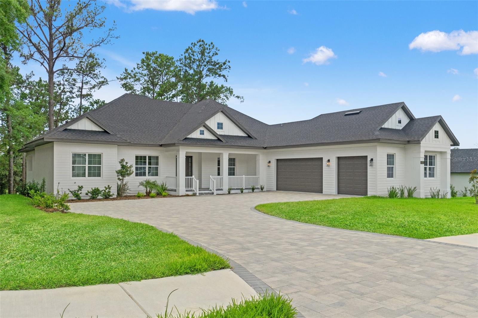 Discover refined luxury in this brand-new, move-in-ready home, ideally situated on the golf course with serene fairway views. This 3-bedroom, 3-bathroom residence features a well-designed split open floorplan, including a versatile flex space or office, tailored for modern living and effortless entertaining. The chef's kitchen, equipped with high-end appliances, contemporary finishes, and ample prep space, simplifies cooking and hosting. The master suite offers tranquil golf course views, a spacious walk-in closet, dual vanities, a soaking tub, and a separate shower. A fully equipped outdoor kitchen with a gas grill, sink, and refrigerator enhances al fresco dining. The open-concept living area, with premium finishes, high ceilings, and abundant natural light, balances elegance and functionality. An oversized paver driveway and 3-car garage provide substantial parking and storage, while a spacious laundry room, complete with washer and dryer, adds convenience. This home blends sophistication and practicality in an exclusive golf course community. Call today to schedule a private tour.