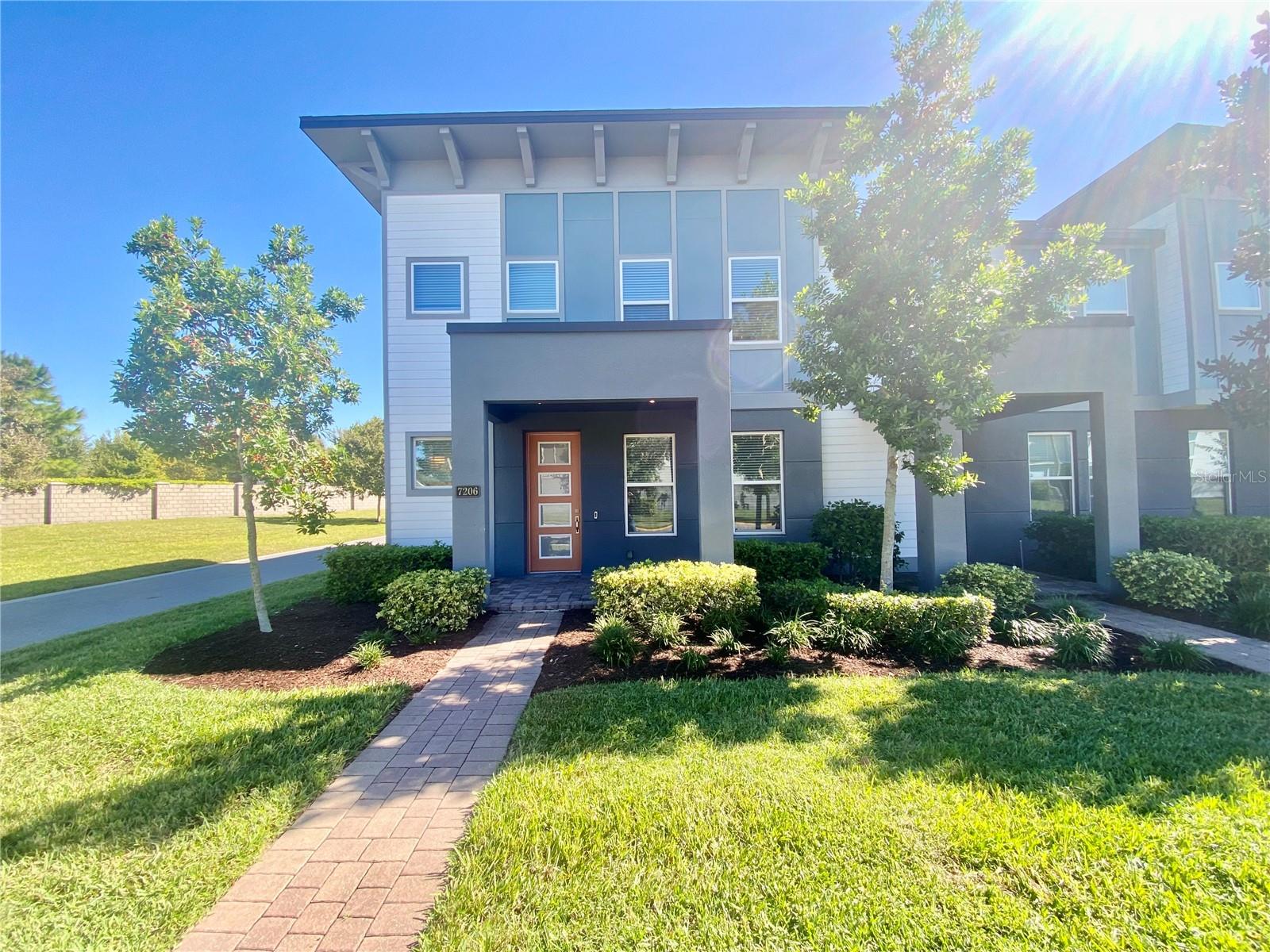 NEWER TOWNHOUSE. CORNER UNIT FOR PRIVACY, 4 Bedrooms, 2.5 Bathrooms, 2-car Garage in the NEWEST AND TRENDIEST Waterfront Community **SAND LAKE SOUND** in DR PHILLIPS!!! ENJOY this Waterfront Gated Community, Community Pool, and Playground! All this and much more just across WHOLE FOODS. Be the first Resident to enjoy *GRAND FOYER ENTRANCE WITH MODERN STAIRCASE*UPGRADED GOURMET KITCHEN WITH WALL OVEN *STAINLESS STEEL KITCHEN APPLIANCES * SPACIOUS PANTRY *LUXURIOUS GRANITE COUNTER TOPS* MASTER BEDROOM WITH SPACIOUS WALK IN CLOSET with WINDOWS, AND GLASS SHOWER * RING DOORBELL WITH CAMERA * HIGH CEILINGS *HIGH DOORS * FAUX WOOD BLINDS *WASHER, DRYER, UTILITY SINK IN Upstairs LAUNDRY ROOM *LANAI/PATIO. BRING your measuring tape, the high ceilings and high doors of the rooms are unfurnished and are larger than you may think! MASTER BEDROOM is 14x13, MASTER CLOSET is 10X6, BEDROOM DOWNSTAIRS is 11x10, BEDROOM #3 is 13x11.8, BEDROOM #4 is 12x11. All of this and much more surrounded by Million Dollar waterfront homes, and minutes from fine Dining at Famous RESTAURANT ROW, I-Drive, Convention Center, Designer Outlets, Universal Studios, and Volcano Bay Water Park.