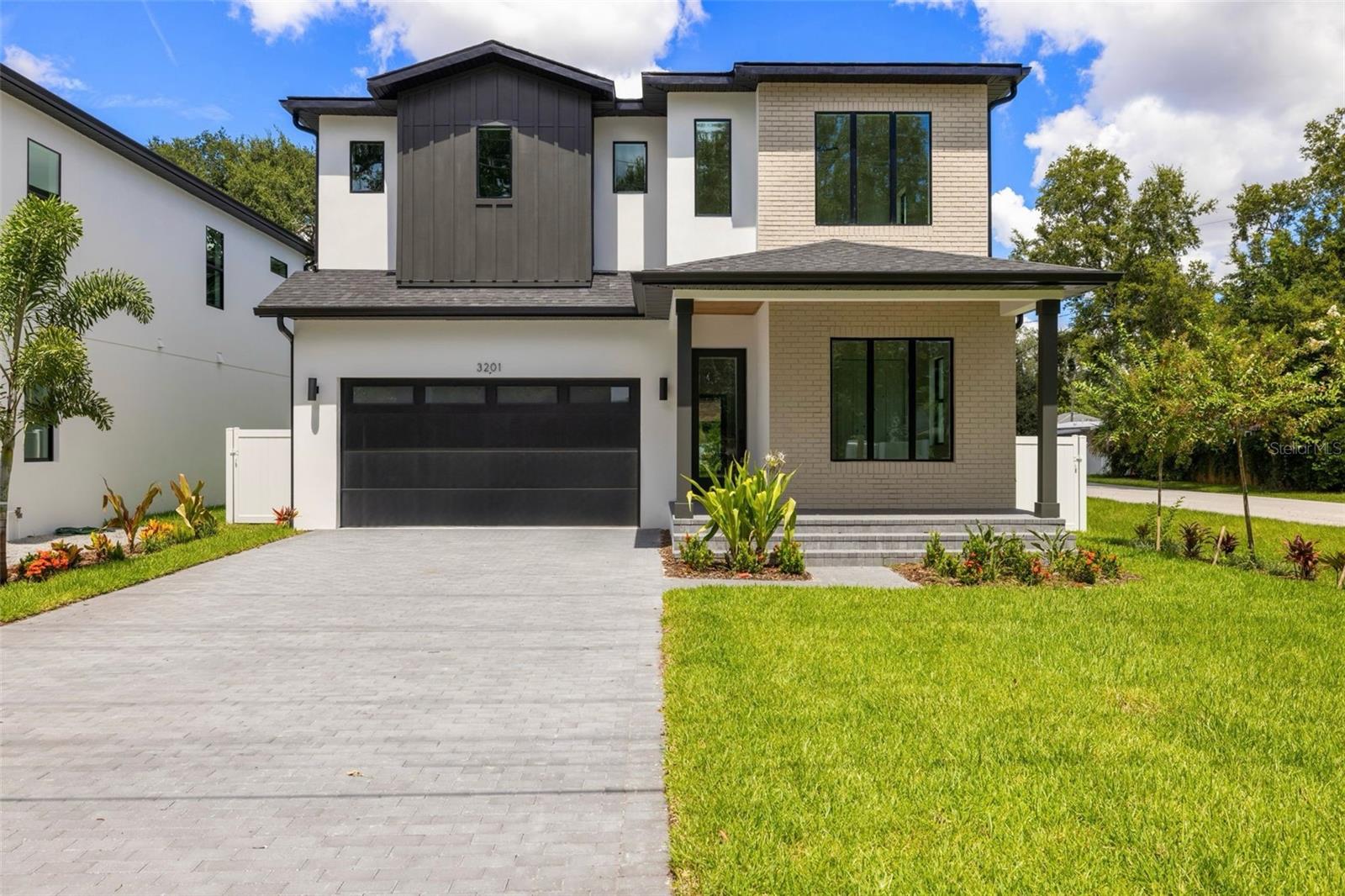 Located in a prime South Tampa location, this new construction pool home by DMF Homes blends timeless elegance with modern luxury. Boasting 4 bedrooms, 3.5 bathrooms, and meticulously selected designer finishes, the open-concept layout offers expansive, light-filled living across both levels. Step inside to a bright and airy main floor featuring soaring tray ceilings, engineered hardwood floors, and 8-foot solid core doors. The chef’s kitchen is a showstopper, complete with quartz countertops, an oversized island, a wine bar, and seamless integration into the living and dining areas—ideal for entertaining. Upstairs, a spacious bonus room offers the perfect retreat for a game room or second living area. The primary suite features a spa-inspired bath and a generously sized walk-in closet. Additional highlights include impact-rated windows, spray foam insulation, level 4 smooth drywall, and a covered lanai overlooking the future pool. No flood insurance is required.