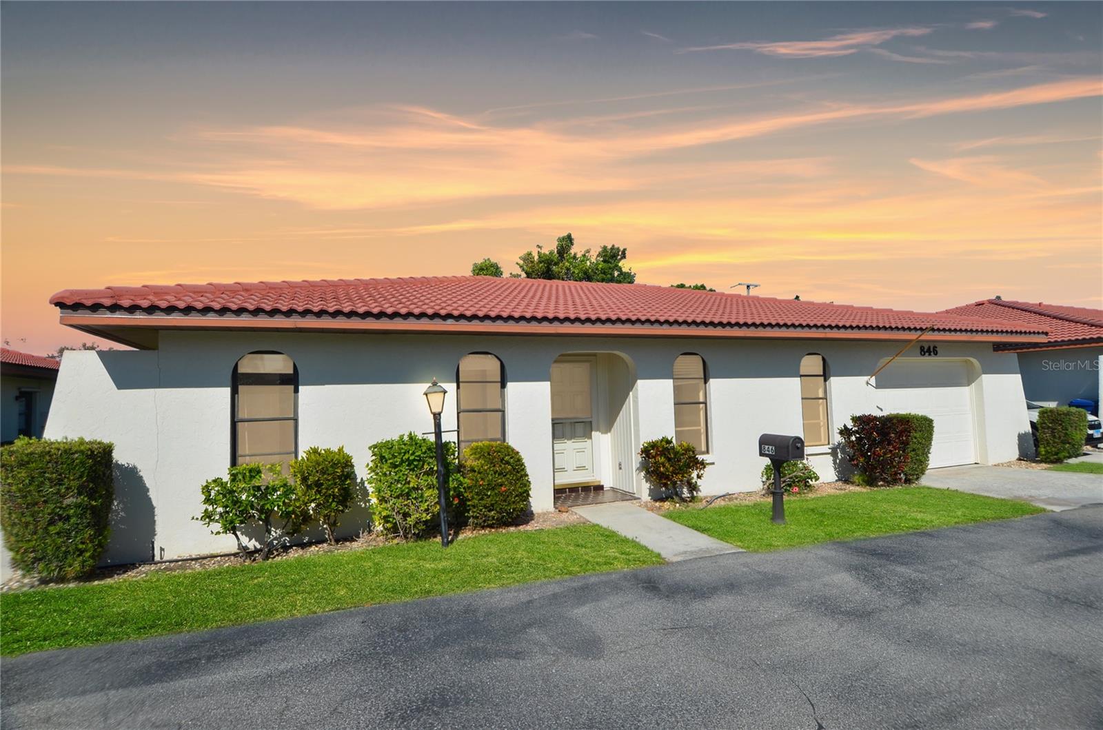 Charming Spanish Villa located in Venice, FL! Welcome to this 2 bedroom, 2 bathroom, 1 car garage home in the appealing 55+ Vivienda community! The home offers a unique layout, with both bedrooms suitably set up at the front upon entry. The primary suite on the right features a walk-in closet and en suite bathroom with a shower/tub combo and a large vanity with ample storage. The second bedroom on the left has two built-in closets and direct access to the second bathroom, which also serves as a guest bath with hallway access. Continue further inside and discover the open-concept living and dining room area—a great place for entertaining or simply winding down. At the heart of the home is a fully equipped kitchen, accented with a tray ceiling, a passthrough window to the lanai, abundant cabinetry for storage, and a pantry closet. Next to the kitchen is a versatile bonus room accommodating the washer, dryer, and utility sink within the attached closet. This space also provides access to both the garage and back patio. At the back of the home, enjoy a spacious enclosed lanai with panoramic windows overlooking the backyard and preserve view. Connected through sliding doors, step out onto the screened and covered patio to experience those peaceful views and refreshing Florida breeze. Vivienda is an intimate and well-maintained community offering residents access to a community pool and bathhouse, perfect for soaking up the sun and reveling in the year-round Florida weather. Home is in close proximity to shopping, restaurants, schools, golf courses, and minutes from Venice Island, Gulf beaches, Sarasota Memorial Hospital-Venice, I-75, Wellen Park, and CoolToday park. Don't miss the opportunity to make this desirable villa your new home!