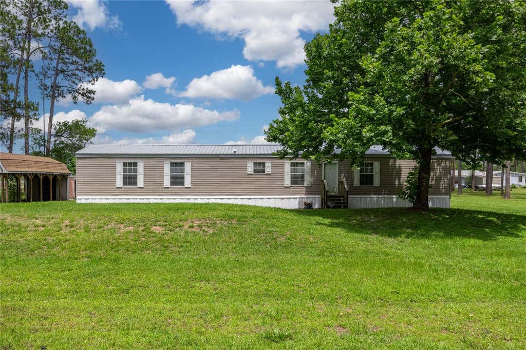 Photo of 116 Tyler Avenue, Interlachen, FL 32148 (MLS # GC541028)