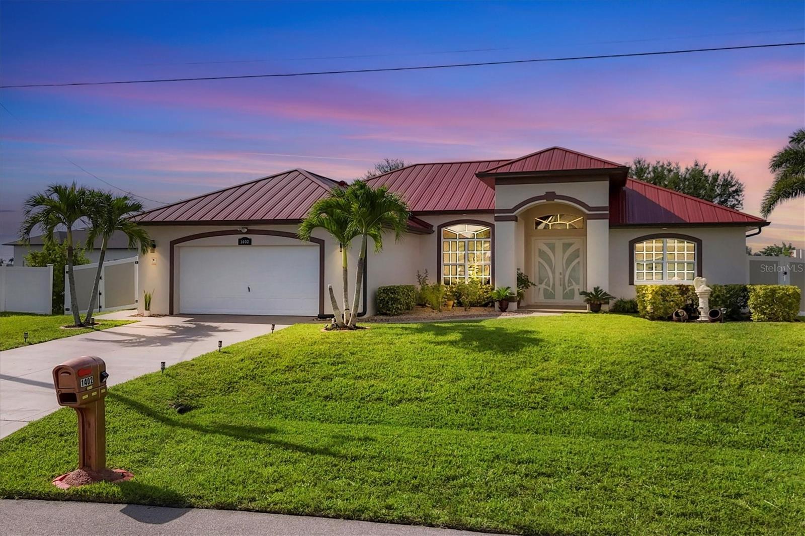 Under contract-accepting backup offers. Florida Living at Its Best – Canal-Front Pool Home in SW Cape Coral!
Welcome to your dream home in a peaceful SW Cape Coral neighborhood—not in a flood zone! This beautifully maintained canal-front property is surrounded by lush landscaping, tall palms, and a custom vinyl fence, giving you privacy and serious curb appeal.
Inside, enjoy tile flooring throughout, 3 spacious bedrooms, 2 bathrooms, a den/office, and a bright open living/dining area with soaring ceilings and triple sliding doors leading to the screened pool. The updated kitchen features a raised granite breakfast bar, new refrigerator (2025), and a sunny breakfast nook/dinning room area with views of the pool and canal—perfect for laid-back mornings.
The primary suite has private lanai access and a spa-like bath with dual granite vanities, a walk-in rain shower, separate toilet room, and a generous walk-in closet. Guest bedrooms are tucked on the opposite side of the home for added privacy. The second bath includes a full tub, updated hardware, and newer toilet.
The laundry room is fully equipped with newer washer/dryer, a utility sink, and storage closet. The 2-car garage has two bonus storage closets and a sleek epoxy floor.
Step outside to your tropical retreat, enjoying the green lawn all year around, an automatic irrigation system in place, a screened pool, freshly painted lanai floor, and peaceful water views framed by Royal Palms. It's the perfect place to relax or entertain.
Major updates include:
· 2025: Refrigerator
· 2024: Impact front door
· 2023: Metal roof, custom vinyl fence, pool heater
· 2022: Water heater, pool pump
· 2016: HVAC, microwave
· Plus: New laundry sink/faucet, new master shower, updated bathroom fixtures, newer garage floor epoxy
Fantastic location! Close to shopping, dining, and major conveniences, and just minutes to Sun Splash Waterpark, Burnt Store Marina, Charlotte Harbor Preserve trails, and the future Crystal Lake Park. A short drive takes you to Sanibel, Captiva, and Fort Myers Beach.
This is the one you’ve been waiting for—luxury, privacy, and Florida charm in one incredible package!