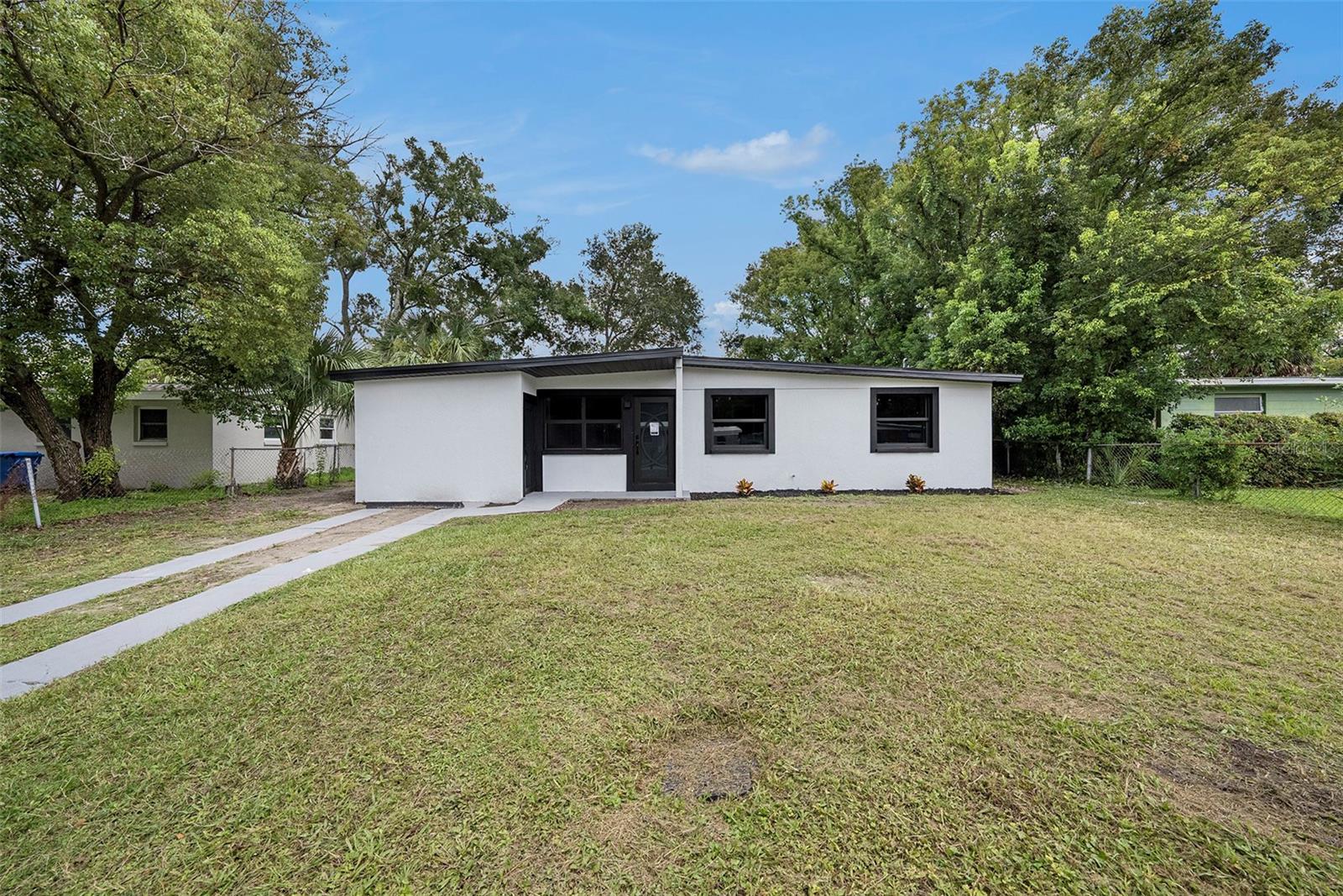 Charming 3-bedroom, 2-bath home featuring a spacious open layout and a large fenced yard perfect for gatherings. Recently completed remodeled from top to bottom, this home boasts a modern kitchen with brand-new cabinets, countertops, and appliances, updated bathrooms, fresh flooring, and stylish finishes throughout. The cozy living area is filled with natural light, creating a warm and inviting atmosphere. Conveniently located near major highways, shopping, and dining, it’s ideal for both first-time buyers and investors. No HOA or CDD fees, giving you the freedom to enjoy your home your way!