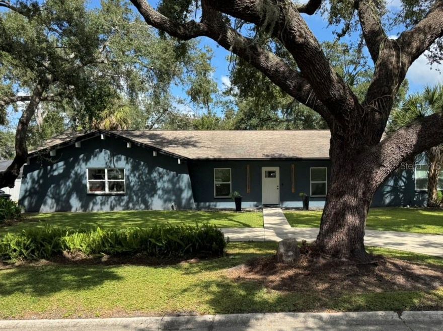 Welcome to 1404 Big Oak Court in Brandon, Florida! This modern mid-century home has everything you need to enjoy the Florida lifestyle. Drive up to a circular driveway and step into the foyer, which boasts higher-than-average ceilings for this style of home. One side of the foyer leads to a space that can be used as a formal dining room or bonus room, while the other side, through French doors, opens to a den or additional bonus area. The foyer flows into an open floor plan featuring a modern kitchen with an oversized granite island, stainless steel upgraded appliances, modern light fixtures, ample cabinet space, and plenty of natural light and has Reverse Osmosis water treatment. The kitchen overlooks the spacious great room, complete with a stone fireplace, updated sliding glass doors, and windows. 
The bedrooms are located on the opposite side of the house, with the primary suite in its own private wing. The primary bedroom offers a walk-in closet, a walk-in shower, a double vanity, and a separate shower and toilet area equipped with a bidet. There are three additional bedrooms and a second full bathroom with a shower and tub. This home has been fully remodeled, including a new HVAC system, updated electrical panel, update plumbing, resurfaced pool interior, new pool pump, and pavers around the pool deck.  Live the Florida lifestyle in your outdoor living space on your well designed lanai with that beachy vibe.  This outdoor space has plenty of room for pool parties. The property is surrounded by mature landscaping, providing shade and charm, and features a circular driveway, an extra parking pad, and a two-car garage. Every corner of this home has been cared for with love!
And the location couldn’t be better—just minutes from shopping, restaurants, the airport, and beaches. This dream home is ready and waiting for you!
