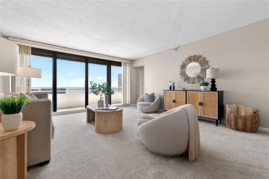 Perched on the top floor as a coveted corner residence, the Penthouse in Pelican Bay building A offers a rare opportunity to experience breathtaking, open water views stretching from vibrant downtown St. Petersburg across the shimmering expanse of Boca Ciega Bay.
From the moment you enter, you’re greeted by walls of floor-to-ceiling sliding glass doors that flood the home with natural light and frame panoramic vistas at every turn. The spacious split-bedroom floor plan is thoughtfully designed for both privacy and comfort, creating the ideal setting for full-time living or a luxurious coastal retreat.

The immaculate and recently refreshed interior features two generously sized bedrooms, each with its own ensuite bath and walk-in closet, offering refined comfort for residents and guests alike. The kitchen is beautifully appointed with solid wood cabinetry, granite countertops, recessed lighting, and a charming casual dinette area perfectly positioned to overlook the sparkling bay — an inspiring backdrop for morning coffee or sunset dinners. Multiple balconies invite you to step outside and savor the sea breezes, glowing sunsets, and twinkling evening lights.

Pelican Bay Condominiums is a resort-style waterfront community nestled within the gates of the Pasadena Yacht & Country Club. Residents enjoy a secure, beautifully maintained environment with pool and spa as well as an option to join the country club offering with lush a waterfront pool and spa, fitness center, clubhouse, and private marina. One of the most exceptional privileges of ownership here is the ability to bypass the waitlist for a highly sought-after golf membership at Pasadena Yacht & Country Club — a valuable benefit. The club itself offers championship golf, tennis, boating, fine dining, and an active social calendar in an elegant yet welcoming atmosphere.

Ideally situated just minutes from Florida’s award-winning Gulf beaches, a short drive to the cultural energy and dining scene of downtown St. Petersburg, and approximately 35 minutes to Tampa International Airport, this penthouse residence truly delivers the best of luxury waterfront living — privacy, prestige, and panoramic beauty — all in one extraordinary address.