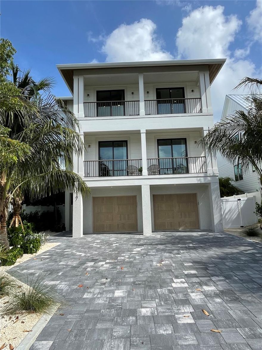 Under contract-accepting backup offers. Introducing an extraordinary opportunity to own a luxurious coastal retreat or a lucrative rental property in the highly sought-after Lido Key area. Presenting an absolutely stunning, 3-level coastal home, currently under construction, this residence is perfectly situated in an enviable location. Boasting an elevator servicing all floors, vaulted ceilings, a rooftop terrace, 8 bedrooms, 8 full baths, and 1 half bath, this masterpiece is now available for sale. Located merely a block away from the pristine shores of Lido Key Beach, this property offers unparalleled convenience, with a leisurely 2-minute stroll to the beach or a quick 4-minute bike ride to the vibrant St. Armand's Circle. Revel in breathtaking vistas from the expansive balcony, providing a captivating preview of the finest views Lido Key has to offer, including the Gulf of Mexico and Downtown Sarasota. Picture yourself savoring coffee or cocktails while basking in the sun on the rooftop terrace, balcony, or expansive patio. Exquisitely designed with meticulous attention to detail, the interior showcases a tasteful luxury coastal palette, featuring premium materials throughout. The ground level of this residence encompasses a 2-car garage, a welcoming entry foyer, and convenient access to the stairs or elevator. Stepping into the backyard, you'll discover a splendid pool, a rejuvenating spa, and a lushly landscaped covered patio, complete with ample seating, offering an idyllic setting for private and memorable outdoor gatherings. The first level of living exudes grandeur, with a magnificent great room encompassing a chef's kitchen, a sizable central island for bar top seating, and an expansive living room and dining area. Additionally, this level accommodates four bedrooms, each with ensuite baths, providing ultimate privacy for your guests. Two of the bedrooms share a generous balcony, perfect for enjoying refreshing breezes and capturing breathtaking sunsets. The entertainment experience continues on the second level, accessible via the elevator or staircase, where you'll be greeted by a second living area featuring a convenient wet bar. An additional four bedrooms await discovery on this floor, including a master suite boasting a standalone tub, a walk-in shower, a walk-in closet, and another generous balcony, offering captivating vistas of beautiful Lido Key. The second floor also presents three more bedrooms, each with ensuite bathrooms, and an additional balcony providing access to the rooftop deck, granting awe-inspiring views throughout the day, including mesmerizing sunrises and sunsets!!!