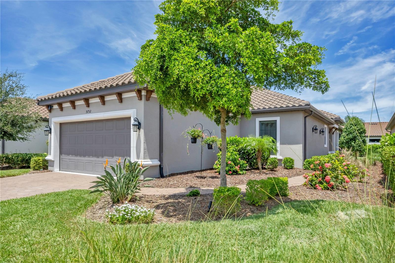 Perfectly located in the gated, Taylor Morrison Esplanade community of Bellacina By Casey Key, this like new, three-bedroom home with a pool offers beautiful style, design, serenity and convenience. From the moment you enter the residence, a sense of calmness takes over, because the home is open and airy, has volume ceilings, is bright and light and is finished in a smooth palate of soft colors. Inside this wonderfully maintained property, you’ll find 18” porcelain tile flooring laid on the diagonal, a spacious kitchen with solid wood cabinetry, quartz countertops, 48” upper wall cabinets, a pantry closet, tiled backsplash, under cabinet lighting, cabinet drawers with dovetail joinery, pendant lighting, GE stainless steel appliances with a natural gas stove and counter height seating for entertaining. Adjacent to that is the dining room that features a tray ceiling with crown molding, a transom window, designer fabric drapery, a decorative chandelier and expansive walls for art. From there, you flow into the family room with more natural light from windows and glass sliders and here you’ll find a volume, tray ceiling with crown molding, decorative chandelier, window treatments and views of the outdoor sundeck. The primary bedroom suite is spacious in size, featuring high ceilings, crown molding, bay windows with shades that look out to the pool, and direct access to an ensuite bath with private water closet, vanity cabinetry with dual, under-mount sinks, and a tiled lined shower with frameless glass. The walk-in wardrobe closet has an upgraded clothing storage system, which help make this area neat and organized. Each of the guest bedrooms are also generous in size and offer walk-in closets with upgraded closet organizing systems, decorative ceiling fans, windows with drapery and blinds and access to a full bathroom with combination shower/bathtub. There’s also a laundry room with an LG front load washer and dryer, a two-car garage with four extra feet in length builder upgrade, a workshop, storage cabinets and professional storage shelves suspended from the ceiling. Outside the back of the cheerful residence is a screened-in brick paver deck with a covered seating area and a kidney shaped dipping pool. The home boasts a brick paver driveway, walkways, storm panels for the exterior window openings, just in case the weather gets a little fickle. The community features an upscale clubhouse with catering kitchen, a fitness room that overlooks the resort-style heated swimming pool with cabanas, an outdoor spa, firepit, pickleball courts, a tennis court, bocce ball court, cornhole station, a playground, two dog parks and an activities director to help keep your social agenda full. At Bellancia there’s no CDD fees and lawn maintenance is included in your HOA fees. There is also gated access to the Sarasota County Legacy Trail from inside the community. From this location, you’re very close to Nokomis Beach, Venice Beach and Siesta Key Beach, plus there’s an abundance of shopping, restaurants, grocery stores, and all that southwest Florida graciously has to offer.