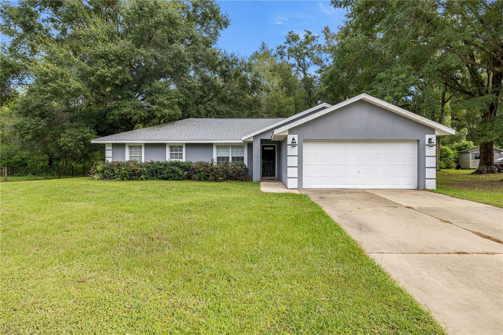 Welcome to this beautiful home in the highly desirable High Pointe community—full of charm, privacy, and direct access to some of Florida’s most treasured outdoor spaces. Perfectly located on a quiet cul-de-sac, this property backs up to the Florida Greenway, providing a rare chance to enjoy nature as your backyard while staying close to everything Ocala has to offer.
Built in 2002, this well-maintained 3-bedroom, 2-bath home has been thoughtfully updated to combine comfort, style, and peace of mind. Step inside to an open floorplan designed for both daily living and entertaining. The spacious living room flows easily into the dining area and kitchen, creating a warm, welcoming space for gatherings. The kitchen includes ample cabinetry, a built-in layout, and appliances purchased in 2022—including the refrigerator, dishwasher, stove, and microwave—so you can enjoy a modern cooking experience from day one.
The oversized primary suite is a true retreat, spacious enough for a king-sized bed, sitting area, or home office nook. The en-suite bathroom includes dual sinks, a soaking tub, and a large walk-in shower—combining relaxation with function. The guest bathroom is also well-appointed with updated fixtures and a comfortable layout. Additional updates include a new water heater and shower fixtures installed in 2022.
For today’s connected lifestyle, the home is wired for both cable internet and fiber optic service—ideal for remote work, streaming, or staying connected with ease.
Step outside to enjoy a peaceful backyard that looks out onto the Greenway, with no rear neighbors for enhanced privacy. It’s the perfect spot for barbecues, gardening, or simply relaxing in a tranquil, natural setting. A concrete driveway and septic system add long-term value and practicality.
Major updates provide added peace of mind: a new roof in 2022, freshly painted interior and exterior, and upgrades to essential systems make this home move-in ready.
Living in High Pointe means you're near shopping, dining, medical centers, and major highways for easy commuting. Outdoor enthusiasts will love being just minutes from the Cross Florida Greenway trails, ideal for hiking, biking, horseback riding, and kayaking. Families will appreciate the close proximity to Legacy Elementary, Belleview Middle, and Forest High School.
Whether you’re a first-time buyer, relocating, or simply looking for a home that blends comfort with location, this property checks all the boxes. It’s updated, well-cared for, and uniquely positioned to enjoy both city conveniences and outdoor recreation.
Schedule your private tour today and discover why 4260 SE 65th Place could be your next home.