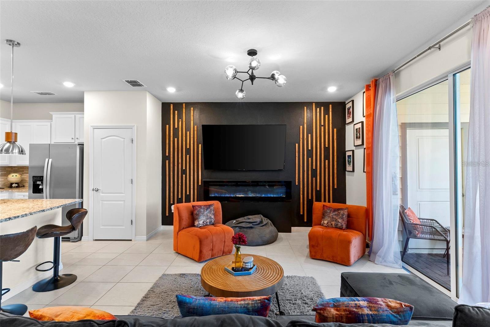 If you are looking for an amazing home away from home, this is it!. It's the dream vacation home near Disney .Totally furnished, extremely well decorated with detailed thematization and with many updates added. This well designed 5 bedroom unit townhouse with it's own screen enclosure private pool and no rear neighbors behind you. Premium Lot, back facing a big pond. Enter the home through the front door into the tiled foyer which opens up into the spacious great room with ample space to accommodate the living area, dining room and games area complete with arcade games. The covered lanai and enclosed pool area is accessed via sliding doors which also provides lots of natural light into the downstairs. Upstairs are 2 suites and another 2 bedroom with a full bath. Upstairs loft and a lot space for family fun time.