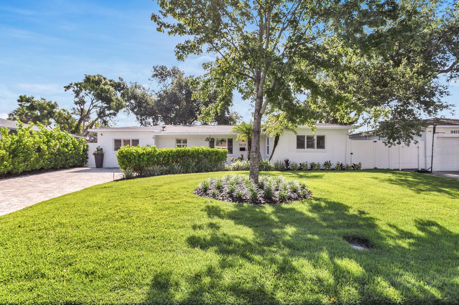 Welcome to 3410 South Omar Avenue, a captivating home that seamlessly blends a spacious backyard, updated interiors, and a versatile bonus room to experience the ultimate Florida lifestyle. This charming 3-bedroom, 2-bathroom residence spans over 1,800 square feet on a generous lot. The open-concept living area flows effortlessly into a beautifully updated chef's kitchen, featuring new quartz countertops, stainless steel appliances, and a convenient breakfast bar. Both bathrooms boast dual sinks, updated showers, and a tub for bath time convenience. Elegantly adorned with plantation shutters, the home exudes warmth and style. Outside, the expansive backyard with a built-in fire pit and large paved patio creates an ideal setting for entertaining. Located in a neighborhood renowned for excellent schools, this home offers easy access to a variety of restaurants, shopping, and the charming ambiance of South Tampa!