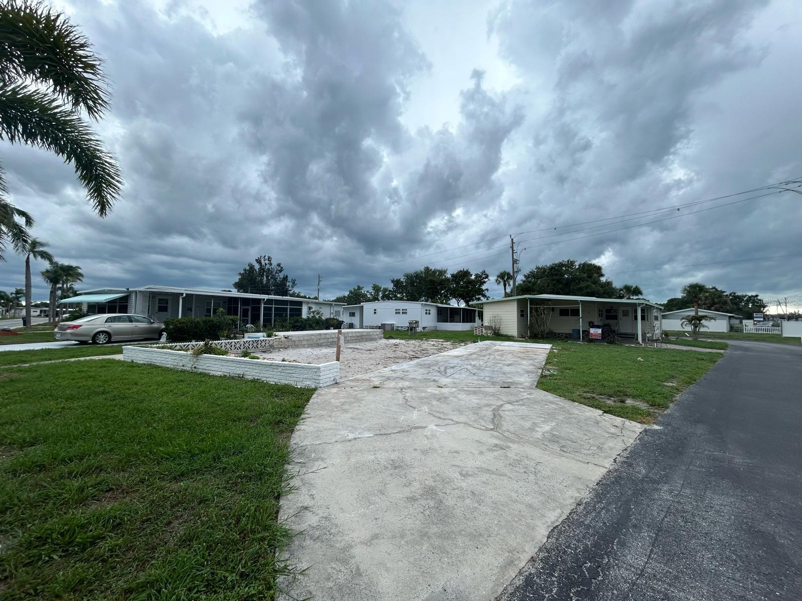 Welcome to Chateau Village: A warm and Welcoming 55+ community full of charm and activity! This VACANT LOT is the perfect spot for your custom single or double-wide home. HOA guidelines are simple: your home must include a carport, a shed and you own the land, so there is NO LOT RENT! Enjoy a low monthly maintenance fee of just $220, which includes water, sewer, trash, cable, internet, access to the community pool, shuffleboard courts, an on-site manager, and even a convenient back gate for easy access. Chateau Village is a beautifully maintained, lively community where neighbors become friends and there's always something to do. Ideally located near great shopping, dining, the airport, and our gorgeous Gulf Coast beaches, this is your chance to live in the Florida lifestyle you have been dreaming of. Do not miss out! Start building your dream home in one of Bradenton’s most connected and caring communities!