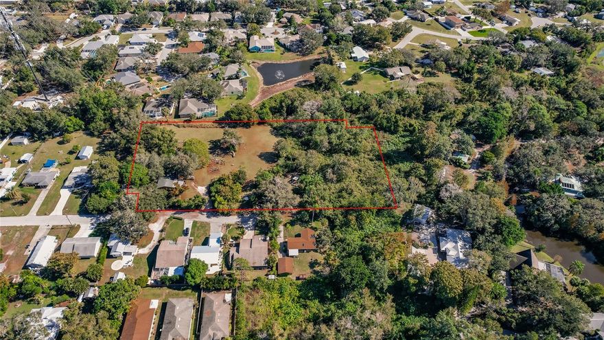 Being sold with ML#A4591802. This is 2.81 acres of beautiful land plus a 3,100s.f. home in the center of Sarasota off of Fruitville Rd. just east of McIntosh Rd.! This property is zoned RSF-3 and features a small pond in the rear corner of the land. It is approximately 50% cleared of trees. The home is on well and septic and was largely re-built about 5 years ago due to a house fire. The home was rebuilt with several guest bedrooms down a single hall and would be perfect as a multiple single-room rental property. Divide the property in half and build a new home on the cleared half or explore building out the property with the maximum number of buildable lots allowable by the County which is a maximum gross density of 12 single-family lots (conventional cluster). Explore this property today. It is a beautiful and exciting piece of land!