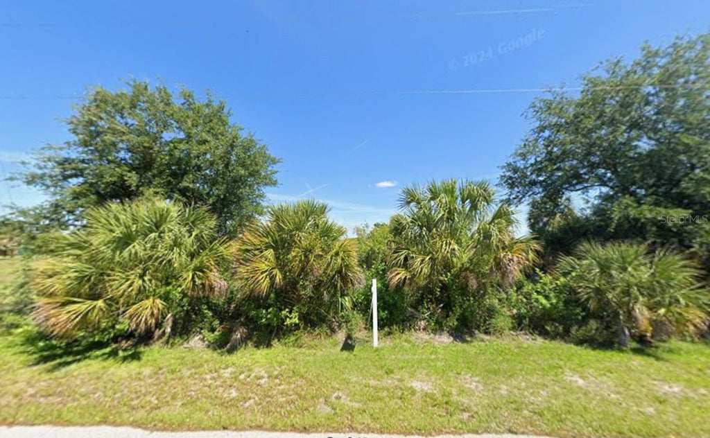 Photo of 6977 Manniz Road, Port Charlotte, FL 33981 (MLS # O6439165)