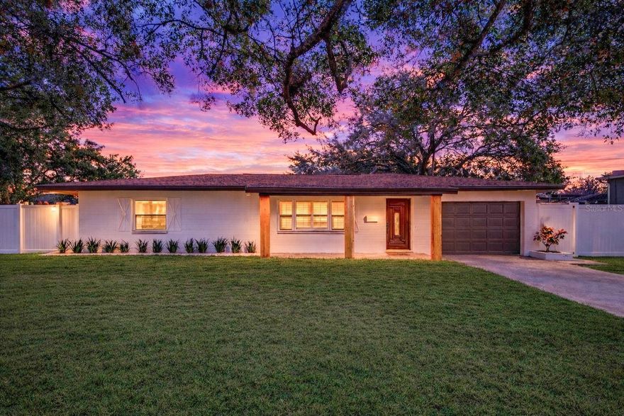 This solid block home is beautifully updated and perfectly positioned on a spacious CORNER LOT in the highly sought-after Crisp Manor neighborhood. Thoughtfully refreshed with gorgeous finishes throughout, the home offers a seamless blend of classic charm and modern comfort. Inside, luxury vinyl flooring enhances the living spaces, while plantation shutters add timeless style. The home features 2 bedrooms, 1 bathroom, and a generous one-car garage, providing a functional and inviting layout. At the heart of the home is a designer kitchen featuring stylish cabinetry, sleek countertops, and modern finishes—perfect for both everyday living and entertaining. Newer French doors open to the backyard, creating a natural flow for indoor-outdoor living. Step outside to enjoy the 10x12 screened porch, a fully fenced backyard, and a convenient storage shed—ideal for entertaining, pets, or simply relaxing. The expansive lot also allows for extra parking, including space for a boat or RV. The well-maintained yard showcases lush landscaping, a large driveway, and a sprinkler system, adding to the home’s strong curb appeal. Located near top-rated schools, the new YMCA, and just minutes from downtown St. Petersburg and I-275, this home is steps from NE Shopping Center, Whole Foods, and the 4th Street corridor, offering exceptional convenience and lifestyle appeal. Move-in ready and meticulously maintained, this is a rare opportunity to own a beautifully updated home in one of St. Petersburg’s most desirable neighborhoods.