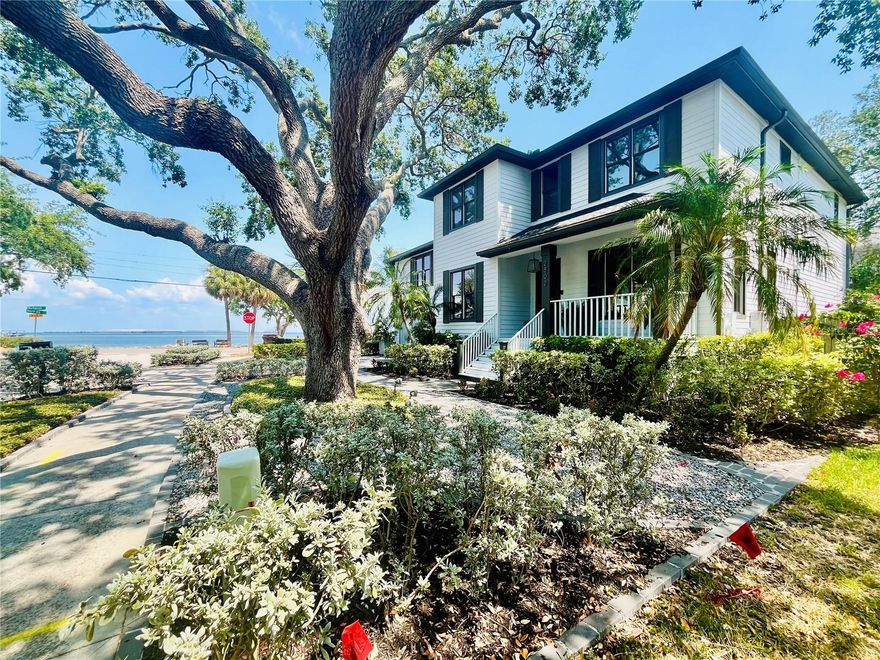 LOCATION, LOCATION, LOCATION! One of a a kind, spectacular Tampa Bay front contemporary home, located on the corner of Bayshore Boulevard and Northpointe Lane with unobstructed waterfront views from nearly every room. No expense has been spared to customize every inch of this nearly 3,800 sq. ft. designer dream home. Interior features wall to wall wide plank oak engineered flooring, marine grade stainless steel and glass staircase, Lindsey Adelman style light fixtures, chef's kitchen with 60" commercial Imperial Range, jumbo kitchen island, and extensive use of quartz, carrera marble, porcelain, and mosaic glass tile. Turkish limestone fireplace, wet bar with commercial grade wine cooler, 10' ceilings, two waterfront ensuites including jaw-dropping primary suite with private sitting room, and water views for miles and miles. Start your day waking up to the golden sunrise over Tampa Bay. In addition, the grand oak that graces the front yard could only be recreated in a story book. In ground pool, extensive professional landscaping, deeded access to Tampa Bay, automatic sprinkling system, charcoal brick paver driveway, smooth level IV finish drywall, frameless glass shower enclosures, jacuzzi and soaking tubs, and much more. This home has been meticulously updated and cared for and is in like new condition. Ideal for entertaining and gracious coastal living.