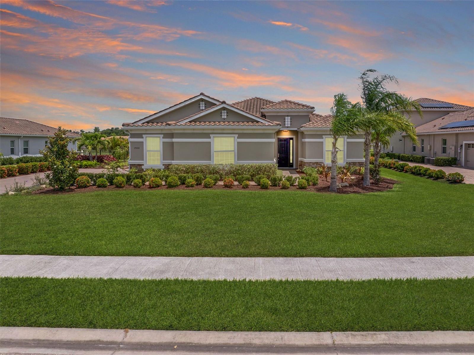 One or more photo(s) has been virtually staged. Welcome to Vilano, a true hidden gem of a Sarasota gated community, where all homes are set on a minimum one acre lot! This amazing home features a large fenced-in backyard, open air heated pool, huge side-loading 3 car garage and much more! With four bedrooms, three full bathrooms and an outdoor pool half bathroom, this open concept floorplan home has it all. Upon entering through the front door, you overlook the open great room, kitchen and dining nook with views of the pool, yard, and lake behind. You’ll notice details like tray ceilings, beautiful tile in the main living area, new bedroom carpets, detailed wood accent walls, and more. The primary bedroom has great views, bath with dual vanities, walk-in shower, and soaking tub. The kitchen has beautiful stone countertops, white shaker-style cabinetry, stainless steel appliances and island with breakfast bar. The additional bedrooms are spacious and one of them has an en-suite bathroom. The outdoor living area has a lovely pool, covered patio area for outdoor dining and summer kitchen, and a fire pit area for cool evenings. This home has been lovingly upgraded and cared for by the original owner, and Vilano is conveniently located to schools, UTC shopping, dining, and even Celery Fields Park. All the other amenities Sarasota has to offer are only a short drive away. You’ll want to schedule your private showing of this fine home today!