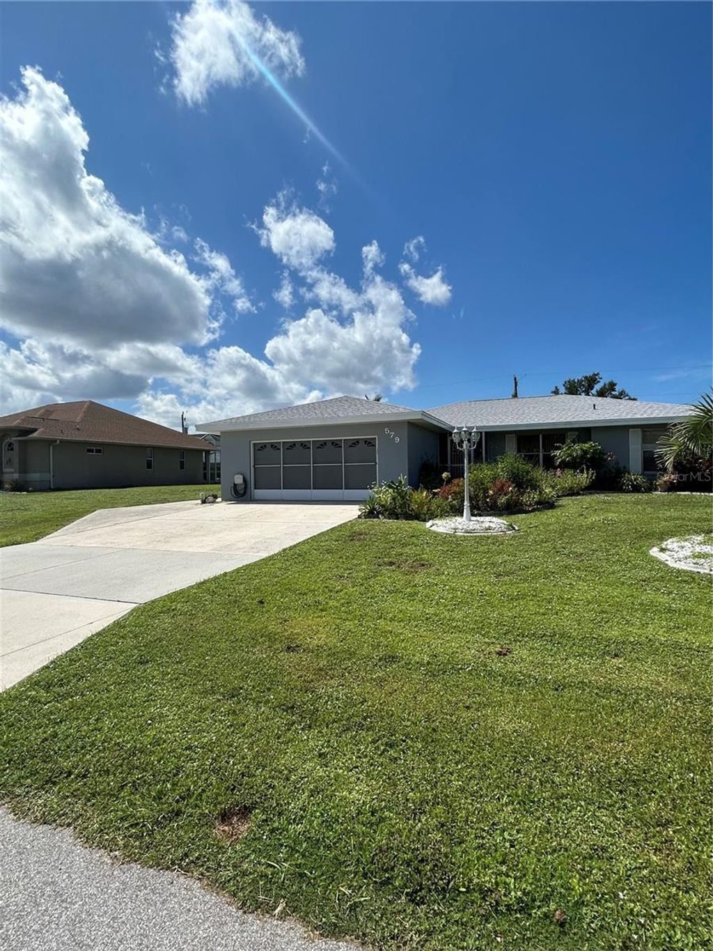 Photo of 579 Lakemont Ave, Port Charlotte, FL 33952 (MLS # C7513540)