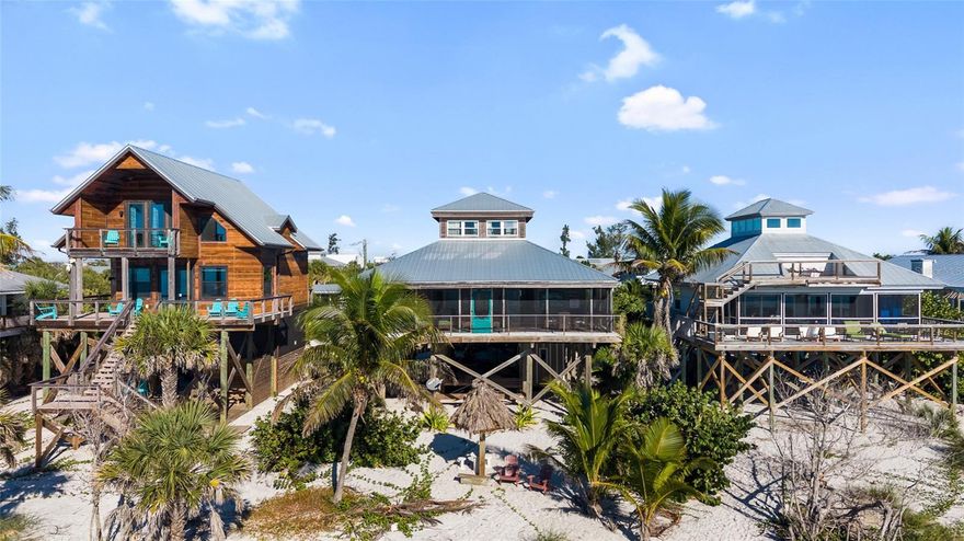 This charming beachfront home radiates Old Florida charm and is located on Little Gasparilla Island. The island is a bridgeless barrier island situated off the coast of the Cape Haze Peninsula accessible only by private boat or water taxi, and it offers a peaceful escape in just a short 10-minute ride across the bay. If you’re seeking a quiet getaway, Little Gasparilla Island is the perfect destination. As soon as you arrive, you’ll feel the stress of the mainland melt away. The home features warm wood walls and floors throughout, creating a cozy and comfortable atmosphere. The spacious, screened-in front porch overlooks the Gulf, providing an ideal spot to unwind. Here, you can watch shore birds meander along the surf, spot dolphins and manatees swimming by, or simply enjoy a restful nap in the hammock, and at the end of the day watch the gorgeous sunsets. The kitchen is equipped with granite countertops, ample cabinetry for storage, and a large pantry. You’ll enjoy beautiful views of the water from the kitchen, dining room, living room, and the loft bedroom upstairs. The screened-in back porch is perfect for savoring your morning coffee while watching the sunrise glow through the trees. Both porches offer unique vantage points to enjoy the natural beauty surrounding the home. Little Gasparilla Island doesn’t have any grocery stores, restaurants, or shops, but has 3 ½ miles of uncrowded beach. Spend your days wandering the shoreline collecting seashells and shark’s teeth, swimming, or relaxing with a good book in the sun. The surrounding waters are excellent for fishing, with opportunities to catch redfish, snook, snapper, trout, and more. Come experience this lovely home and discover what it’s like to live on island time, surrounded by natural beauty and tranquility.