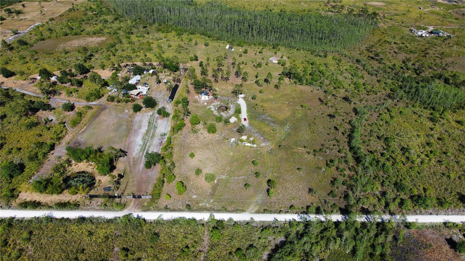 Whether you’re a developer, investor, or future homeowner, this is a golden opportunity to own a substantial piece of land in one of Central Florida’s most desirable and fast-growing areas.This expansive property offers ample space to build a custom home. The possibilities are endless. Enjoy the peace and privacy of rural living while still being just minutes away from shopping, schools, restaurants, and major roadways. Total of approximately 7.54 acres (5-acre primary lot + two adjoining parcels)