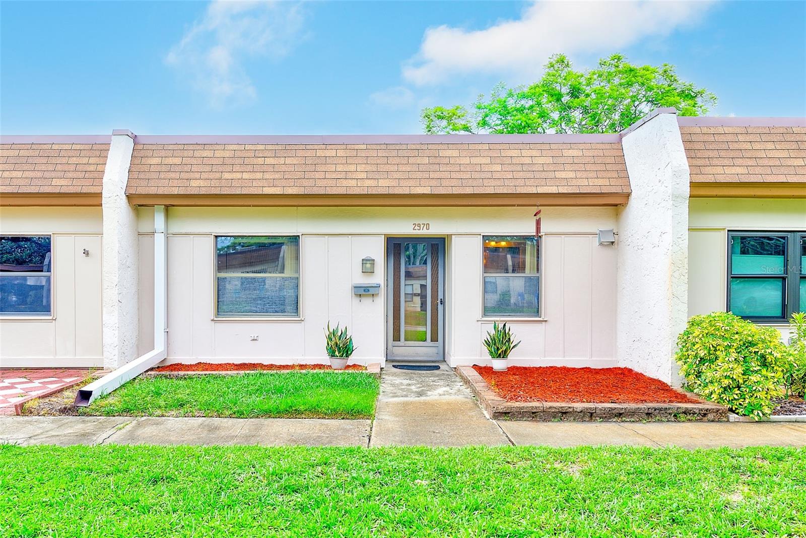 Welcome to this FURNISHED 2-bed, 1-bath villa in the desirable 55+ Mission Hills community in Clearwater. Step inside to a light-filled, open-concept layout featuring tile flooring throughout and an extended living space perfect for relaxation or entertaining. The kitchen offers granite countertops and stainless steel appliances including a brand new gas range. The split bedroom layout provides privacy and ample space, while the renovated bathroom showcases a walk-in tiled shower and updated vanity. Enjoy the convenience of in-unit laundry. There is one assigned carport spot, a storage closet as well as on-street parking. The monthly condo fee covers cable, internet, natural gas, water, sewer, trash, roof, exterior and grounds maintenance, and access to fantastic amenities. The active Mission Hills clubhouse offers a social space (card games, bingo, dinners, ice cream socials, dancing and more), library, fitness area, ping-pong & pool tables, laundry facilities, shuffleboard, and a heated swimming pool. Central Clearwater location with direct access to Kapok Park and the Ream Wilson Clearwater Trail, and just minutes from shopping, grocery, dining, healthcare, airports, entertainment, the best beaches, and the downtown areas of Safety Harbor and Dunedin.