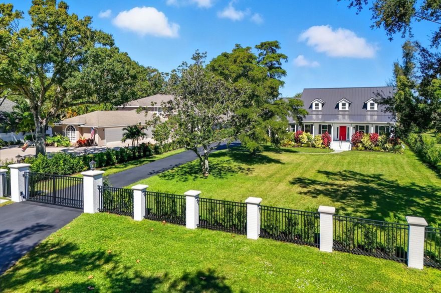 A rare opportunity to own one of the most breathtaking homes on the Bradenton Country Club golf course, where timeless architecture meets refined restoration. Perfectly positioned on the 15th green and 16th tee, this estate offers sweeping panoramic views of the private course, creating a setting that feels both grand and serene.
Beyond the brand-new private gate, you’re welcomed onto a stunning .73-acre estate surrounded by lush, mature landscaping and a sense of privacy rarely found in this coveted community. Every inch of this home has been restored with meticulous attention to preserving its original character, while seamlessly blending in exquisite modern updates.
Inside, the craftsmanship is undeniable with restored hardwood floors, intricate woodwork, and abundant natural light that create an atmosphere of understated elegance. The living and dining rooms flow seamlessly, while the family room, dining, and kitchen areas form an entertainer’s dream, providing effortless spaces for gatherings large and small. The chef’s kitchen is a true showpiece, featuring top-of-the-line ZLINE appliances, a 5-burner stainless steel gas cooktop with custom hood, ice maker, wine and beverage refrigerator, and a thoughtfully designed layout under soaring cathedral ceilings.
The owner’s suite, conveniently located on the main floor, offers a peaceful retreat with a spa-inspired bathroom, flooded with natural light and featuring a private steam room. Upstairs, three spacious bedrooms share a Jack-and-Jill bath, while a loft provides a cozy sitting or study area. Step onto the oversized upper deck to enjoy spectacular panoramic golf course views, which is the perfect spot for sunset cocktails, morning coffee, or entertaining guests.
This home is as functional as it is beautiful, with a large laundry suite, California Closets throughout, 1.5-car garage and golf cart space, and abundant guest parking. Modern amenities have been thoughtfully added, including dimmable lighting throughout that allows you to set the perfect ambiance in every space, a new roof, two new HVAC units, a new water heater, a new propane tank, and a new resort-style pool and spa.
Relax or entertain outdoors on spacious covered porches overlooking the manicured grounds and emerald fairways. The result is a property that feels like a private retreat, an estate of rare quality, elegance, and soul.
Just minutes from top-rated schools, GT Bray Park, and the beautiful sands of Anna Maria Island, this home offers the best of Florida’s coastal and country club lifestyle. Truly, a one-of-a-kind residence where classic charm meets modern perfection.