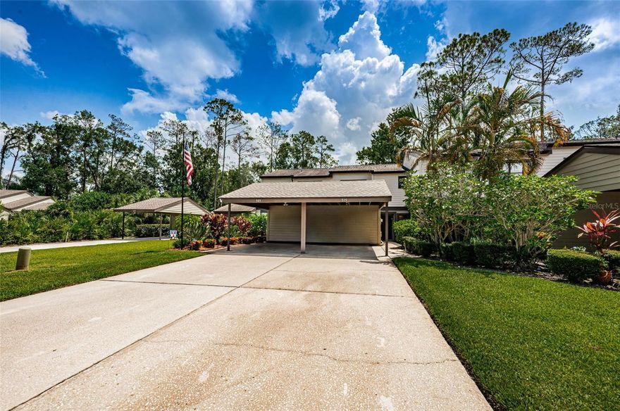 Completely updated, water view townhome within the 24hr guard gated, golf cart friendly, country club community of East Lake Woodlands! This home has been updated, barely used, meticulously kept and has it all: 2 bedrooms (the master bedroom offers an amazing water view) each with en suite full bathrooms and walk in closets, plus an additional half bathroom downstairs, inside laundry, a charming fenced in front courtyard style patio with a spacious storage closet, a large glass enclosed sunroom, an open backyard with amazing water views, a large attached carport plus room for 2 additional vehicles in the driveway and ample guest parking right across from the driveway! The heated and private Woods Landing community pool is just steps away!! THE GOODS: Brand new kitchen in 2019 (barely ever been used) offering: new shaker style wood cabinets, high end laminate counters with a elevated breakfast bar, updated plumbing fixtures, updated appliances, new laminate flooring, plus removal of old lighting system and replaced with recessed lighting! All 3 bathrooms have been updated offering: new vanities with solid surface counters, new plumbing fixtures, new mirrors, new lighting, new toilets, new flooring and fresh paint/trim! Fresh paint/trim throughout the entire home. Updated fans/lighting fixtures throughout. New carpet throughout all living areas and new laminate flooring in all the wet areas, as well as in sunroom. New washer and dryer! New custom blinds on all windows! All exterior wood replaced by HOA as needed and exterior freshly painted by HOA. Plus, non evacuation zone/non flood zone! This home has been lightly used as a vacation home (available fully furnished) and is very spacious! There is ample storage throughout: each bedroom has a walk in closet, plus a large closet at the base of the stairwell, plus another "secret" door under stairwell for more storage! Additionally, the outside storage closet in the front courtyard can hold your bikes and Florida toys. This home is full of natural light! There are 3 large glass sliders off the great room leading to the sunroom that offer pure, serene water views! The glass enclosed sunroom can fulfill any need and can be completely opened up to take in the fresh air in the upcoming months! There are so many options for this space (gym, office, playroom, etc)! The back yard is perfect: there is a spacious grassy area for any of your Florida style outdoor ideas (firepit zone, grill area, etc) -or just as an open space to enjoy! The lush surroundings and sparkling water views from this home offer complete serenity! Your monthly fee of $590.68 COVERS IT ALL: roof (maintenance & replacement), insurance, building exterior maintenance/upkeep, escrow reserves, cable, internet, trash, common grounds maintenance (beautifully kept!), property manager and a heated pool for use by Woods Landing Trail only! PLUS the golf cart friendly community of East Lake Woodlands offers so many ways to enjoy Florida living: a huge pool area with a heated lap pool and a separate play pool (these are in addition to Woods Landing's private pool), plus a kids splash pad area, poolside putt putt golf and a quaint cafe/bar to enjoy meals poolside! East Lake Woodlands boasts gorgeous golf courses, a newly renovated club house with a fabulous indoor main bar & restaurant, spacious fire pit area and a gym with all the classes you need! Plus ample tennis courts and pickle ball courts! This is Florida resort style living!!!