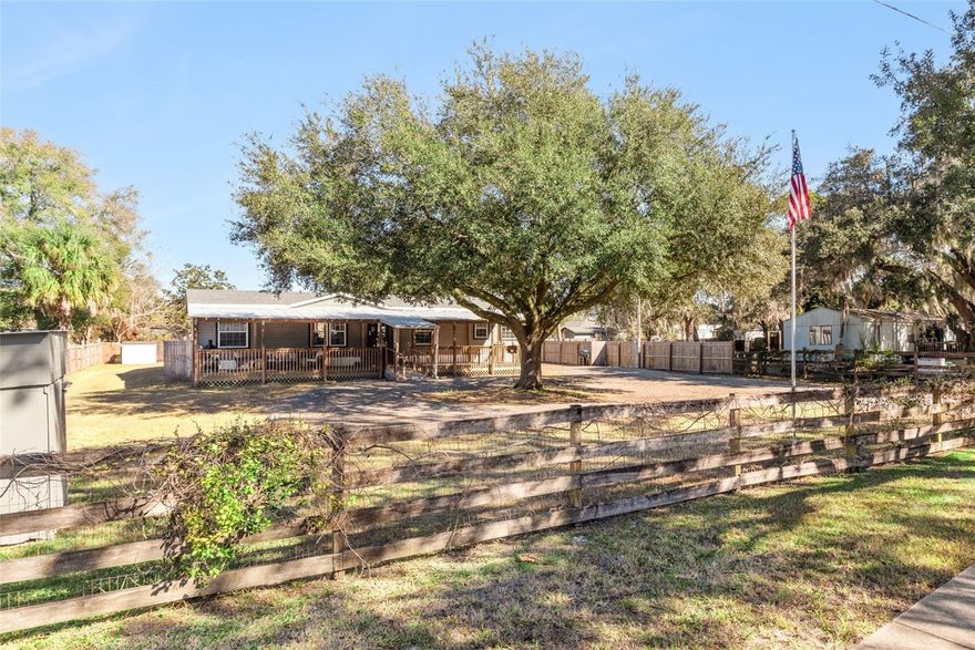 Welcome home, where space, style, and freedom come together beautifully. Situated on a just under 1/2 acre oversized lot in a NO HOA community on the desirable East Orlando side, this move-in-ready home offers the perfect blend of comfort and convenience.  Enjoy peace of mind with a brand new roof (2026) and appreciate the thoughtfully updated kitchen, appliances, and bathrooms (2024/2025), along with newer flooring and interior paint that give the home a fresh, inviting feel. The spacious floor plan is filled with natural light, creating a bright and airy atmosphere throughout.  The property features a spacious front yard and is fully fenced with a gated entry, offering added privacy and security. A large backyard, beautiful mature trees, and ample space for entertaining make this home ideal for gatherings, outdoor living, or simply relaxing in your own private retreat.  Conveniently located near major highways, UCF, and Waterford Lakes Town Center, you are just minutes from shopping, dining, and everyday essentials while still enjoying the charm of a quiet neighborhood.  Whether you are planting roots or starting your next chapter, this is a place where you can truly bloom. See it today and find your next home to bloom, grow, gather, and thrive in.