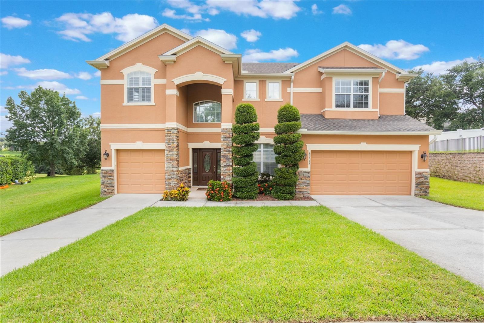 Welcome to this Beautiful and Meticulously maintained 5 Bedroom, 4 Bathroom and 3 car garage home at The Overlook at Lake Louisa in the heart of Clermont. This home boasts 3,593 square feet and sits on the largest lot in the neighborhood. This home has a new roof, recently renovated kitchen and master bedroom. The master bathroom has dual vanities, garden tub and separate shower and large walk-in closet. Upstairs enjoy movie night with Family and Friends in your own Media room, the upstairs loft provides another seating area with your own wet bar. Conveniently located close to Hwy 50, Hwy 27, and the 429, just minutes away from shopping dining and entertainment This home has been Beautifully decorated and purchasing the home furnished is negotiable. Schedule your private showing today you have to see this exceptional property in person!