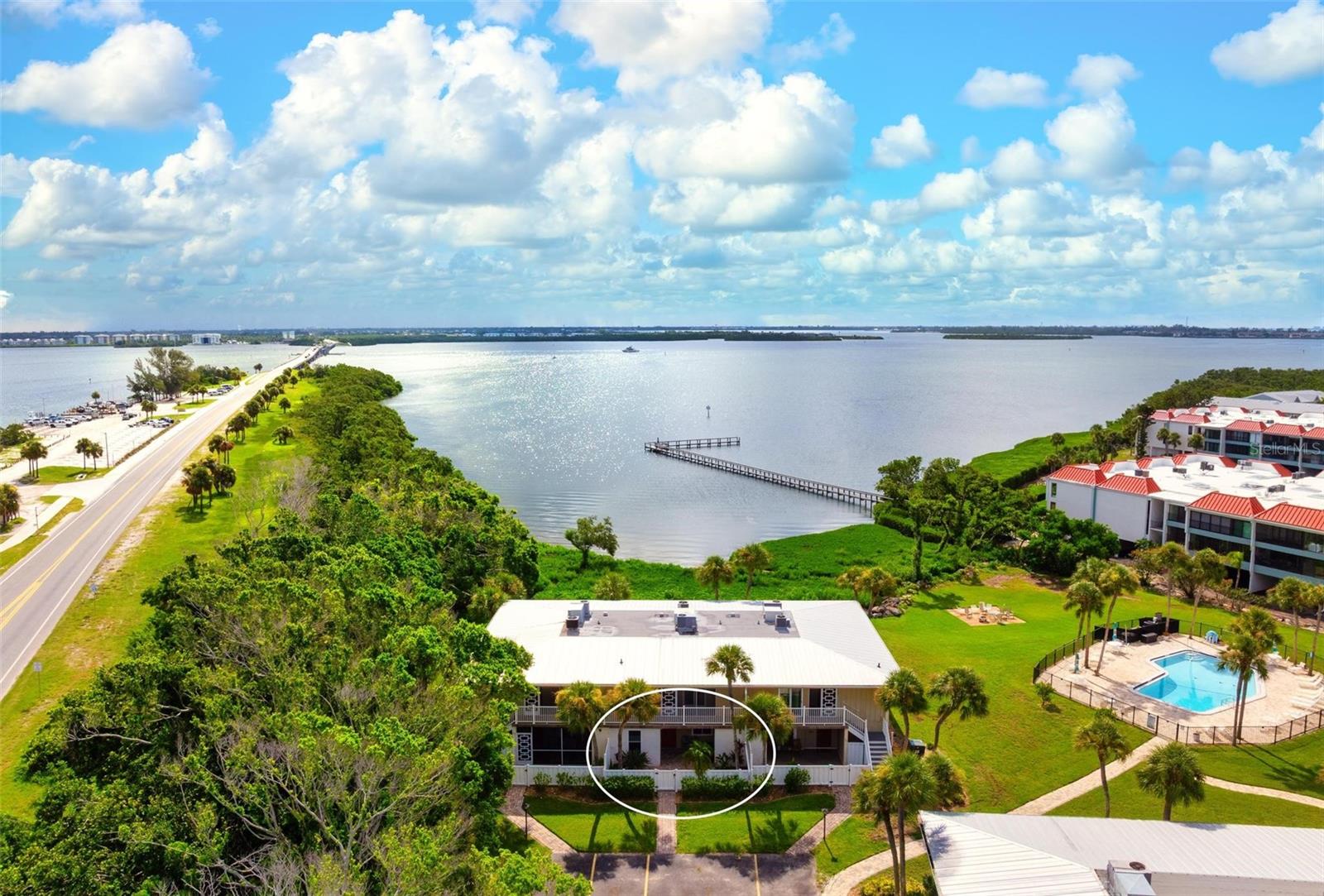 Rare 3-Bedroom Bayfront Condo on Anna Maria Island – First Floor Convenience! Welcome to your dream waterfront retreat in this exceptional first-floor condo, a true gem on Anna Maria Island! This stunning 3-bedroom, 2-bathroom unit showcases breathtaking bay views, where playful dolphins can often be spotted swimming by. Enjoy the ease of single-level living, eliminating the need for stairs or elevators. The expansive open-concept living and dining area is bathed in natural light, creating an inviting atmosphere that’s perfect for both relaxation and entertaining Step outside to discover two fantastic outdoor spaces: a charming front patio where your furry friends (up to two dogs) can enjoy the fresh air within a fenced area, and a back patio showcasing sweeping water views of Anna Maria Sound —ideal for savoring your morning coffee or hosting sunset gatherings. The well-appointed, updated kitchen features stainless steel appliances and modern finishes, making it perfect for culinary enthusiasts. The spacious master suite includes an ensuite bath with tranquil water views, while two additional bedrooms provide ample space for family, guests, or a home office. As part of a vibrant community, you’ll enjoy fantastic amenities, including a tennis/pickleball court, convenient kayak and paddleboard storage, and a refreshing pool where you can unwind or relax poolside with friends and family. Importantly, this condo is situated on some of the highest ground on Anna Maria Island, offering peace of mind with no past hurricane or flooding damage. It also boasts impact-resistant hurricane windows for added safety. You’ll appreciate the convenience of easy access on and off the island, along with being just a short walk from the beach, boat ramp, shops, restaurants, and free trolley stops to explore the charm of Anna Maria Island. With easy access to three international airports, this condo is the perfect full-time residence, seasonal retreat, or rental investment property. Don’t miss your chance to own this unique first-floor gem in a coveted location! Contact us today for your private showing and start living the ultimate island lifestyle with your beloved pets!