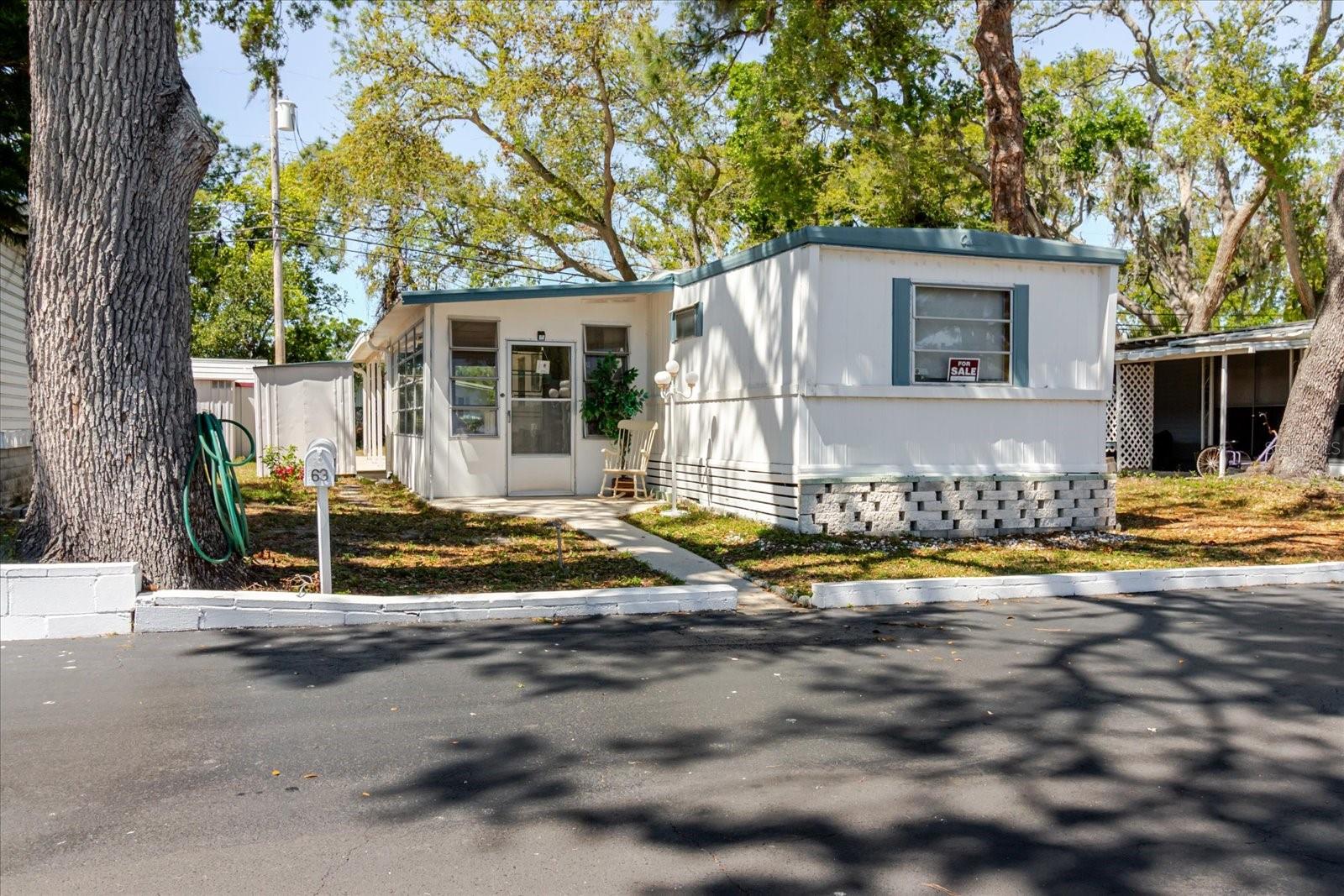 FURNISHED 2BR/2BA HOME IN 55+ CO-OP | NO LOT RENT | NOT IN A FLOOD ZONE!
Enjoy the Florida lifestyle in this charming and storm-tested home located in a well-maintained 55+ co-op community with a low $180/month fee that covers water, sewer, trash, and common area maintenance.
This fully furnished residence features a split-bedroom layout with two primary suites, each offering its own private full bathroom—perfect for hosting guests or shared living. The open-concept kitchen and living area flow seamlessly into a spacious enclosed Florida room, offering plenty of extra living space year-round.
A covered carport provides shade for your vehicle and parking for two extra vehicles as well, and two sheds & a pressure washer adds convenience and storage. All appliances, small kitchen electrics, plus the washer and dryer, convey.
Proven resilience—no flooding during Hurricanes Milton or Helene. Cash only purchase. Enjoy resort-style 55+ living just 15 minutes from Gulf beaches, shopping, dining, and top medical facilities.
Affordable, comfortable, and move-in ready—schedule your private showing today!
