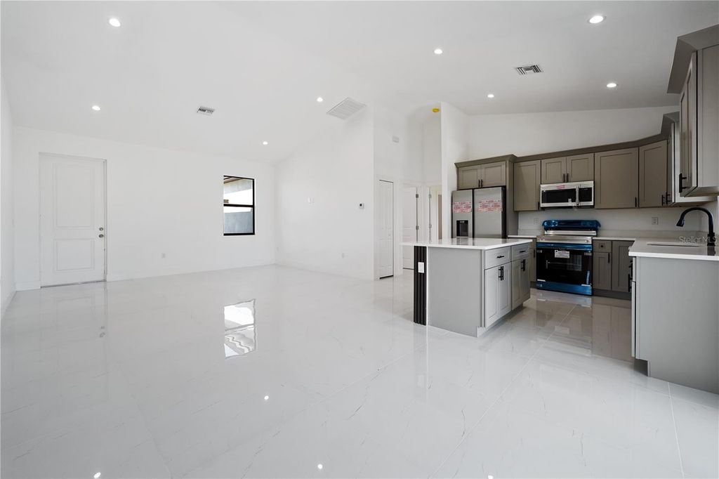 Photo of 2458 NW 9th Terrace, Cape Coral, FL 33993 (MLS # TB8448214)