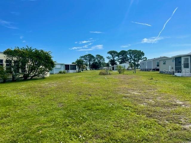 Opportunity Awaits with this beautifully cleared parcel in the Pet Section of the highly sought-after 55+ Holiday Park in North Port, FL. his community is surrounded by mature, lush landscaping and offers scenic views with lots of greenbelt space. A perfect place for you and your furry companions! Insert your dream design Manufactured Home into this connected Water/Sewer vacant lot and start having fun today. This parcel is located on a cul-de-sac street and is positioned as an inside lot, so traffic is minimal. In Holiday Park, you own your own land via deed and the Annual Maintenance Fee is paid in the Sarasota County Tax Bill which helps you to not have the additional monthly expenses. Begin living the lifestyle you have dreamed of surrounded by an amazing itinerary of amenities. Some include but are not limited to: 2 Heated Pools, Shuffleboard, Pickleball, Tennis, Bocce, Laundry Facility, Billiards, Fitness, Cards, and more. Sports fan you say?? This community is minutes away from the Atlanta Braves spring training facility. Located near shopping, restaurants, beaches and more...look no further and seize this opportunity today.