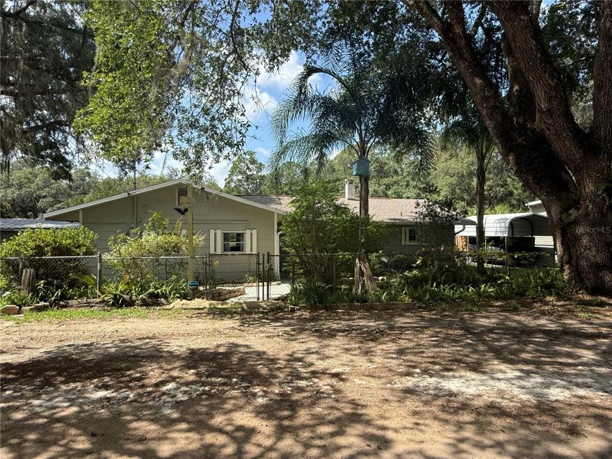 Rare Find! Sportsman's Paradise! Big Lake Kerr access from this canal front 2 Bedroom 2 Bath home located in the hidden community of Point Pleasant near Salt Springs. The home is in very good condition with large rooms, perfect for those family get togethers. There is a large screen room overlooking the water. There is even another 2 bedroom, 1 and 1 1/2 bath home on the property (currently being used as a shop) with it's own power, well and septic. Needs work but lots of potential. Beautifully landscaped large chain link fenced yard with majestic live oaks. 135' OF WATER FRONT WITH SMALL BOAT RAMP AND OPEN DOCK READY FOR YOUR PONTOON, FISH OR SKI BOAT. All this hidden in the Ocala National Forest.