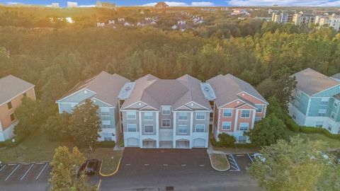 Photo of 12843 Madison Pointe Circle #107, Orlando, FL 32821 (MLS # O6257896)